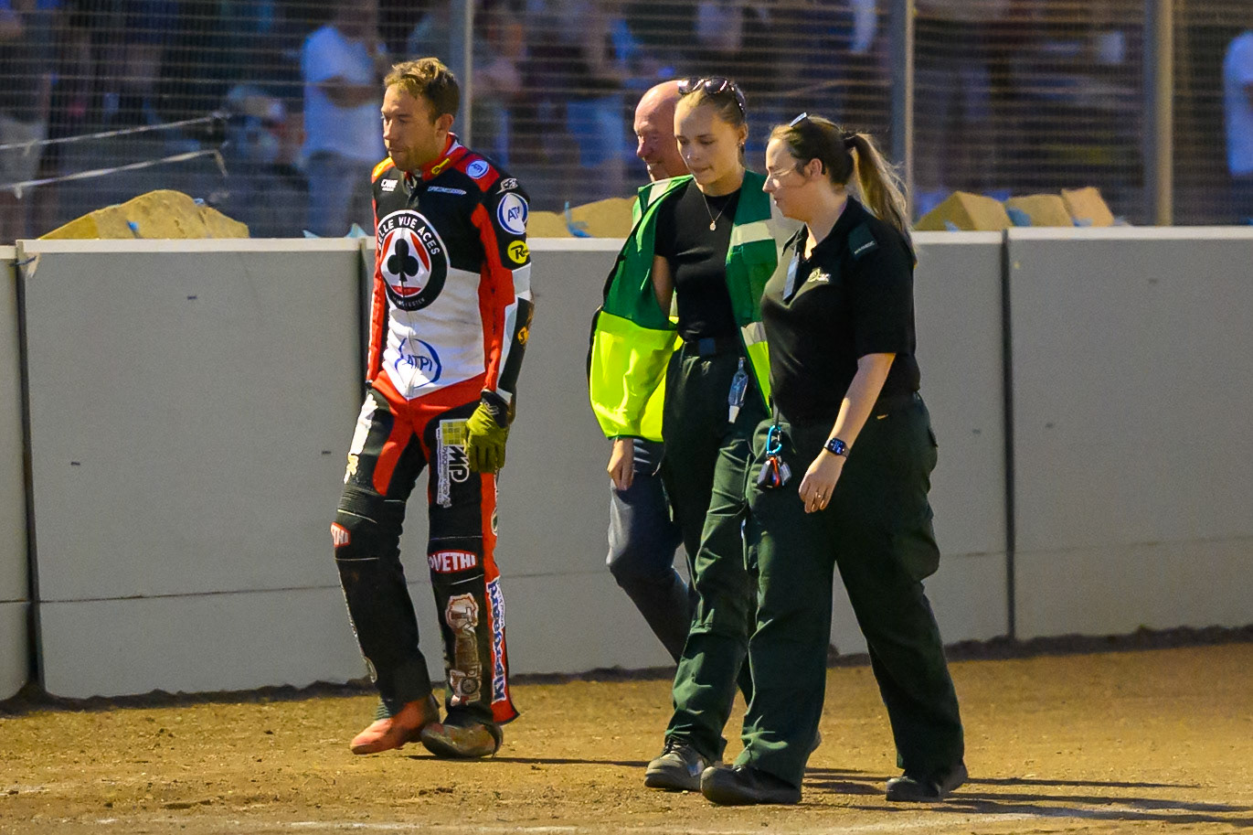 Peter Kildemand of Belle Vue Aces  (Left) walks back to the pits after his heat 10 fall with the paramedics during the Rowe Motor Oil Premiership match between Northampton Foxes and Belle Vue Aces at Northampton International Shaleway, Northampton on Thursday 13th August 2026. (Photo: Ian Charles | MI News)