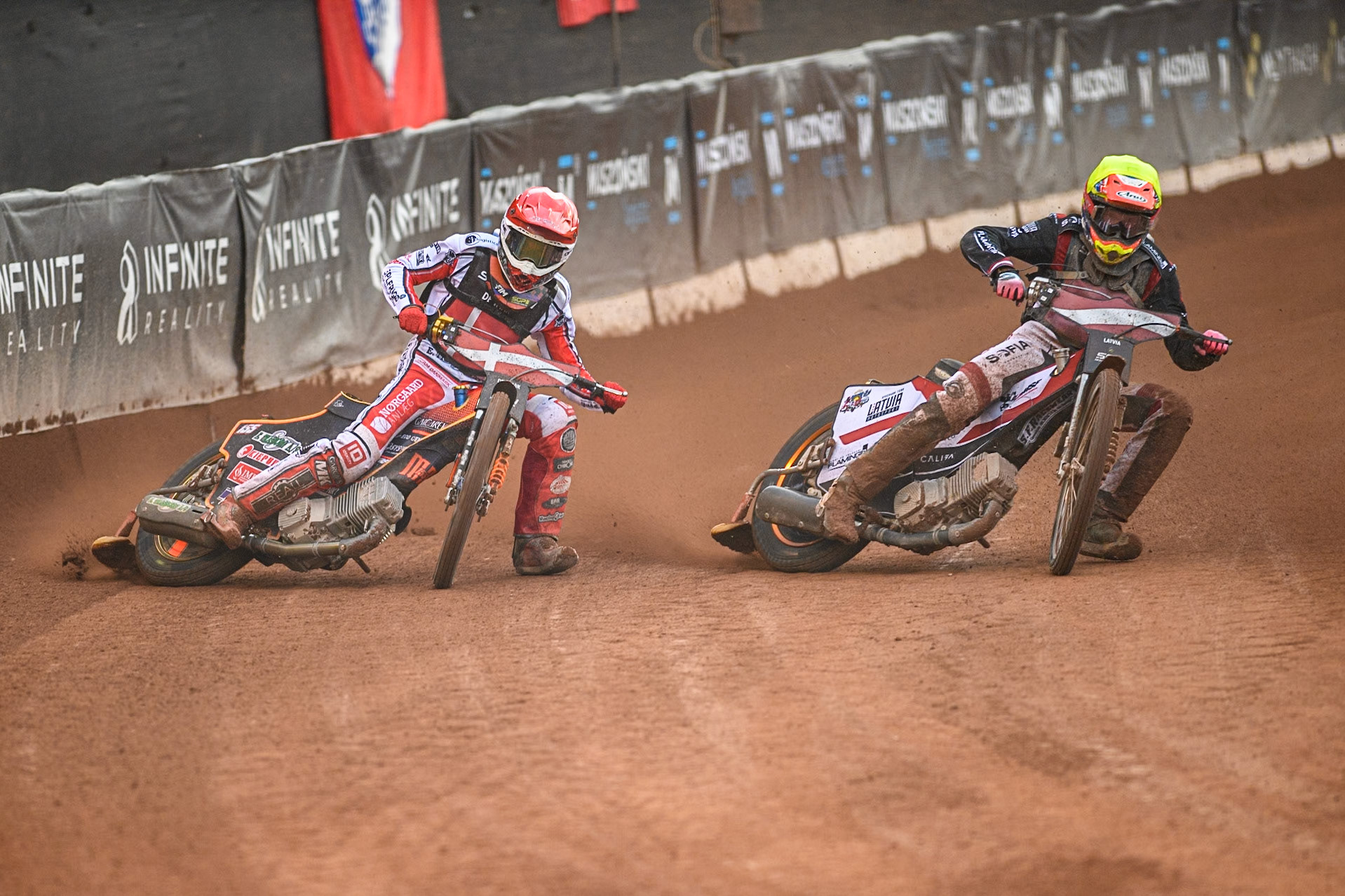 Daniils Kolodinskis of Latvia in Yellow rides inside Mikkel Michelsen of Denmark in Red during the Monster Energy FIM Speedway of Nation Final at the National Speedway Stadium, Manchester on Saturday 13th July 2024. (Photo: Ian Charles | MI News)