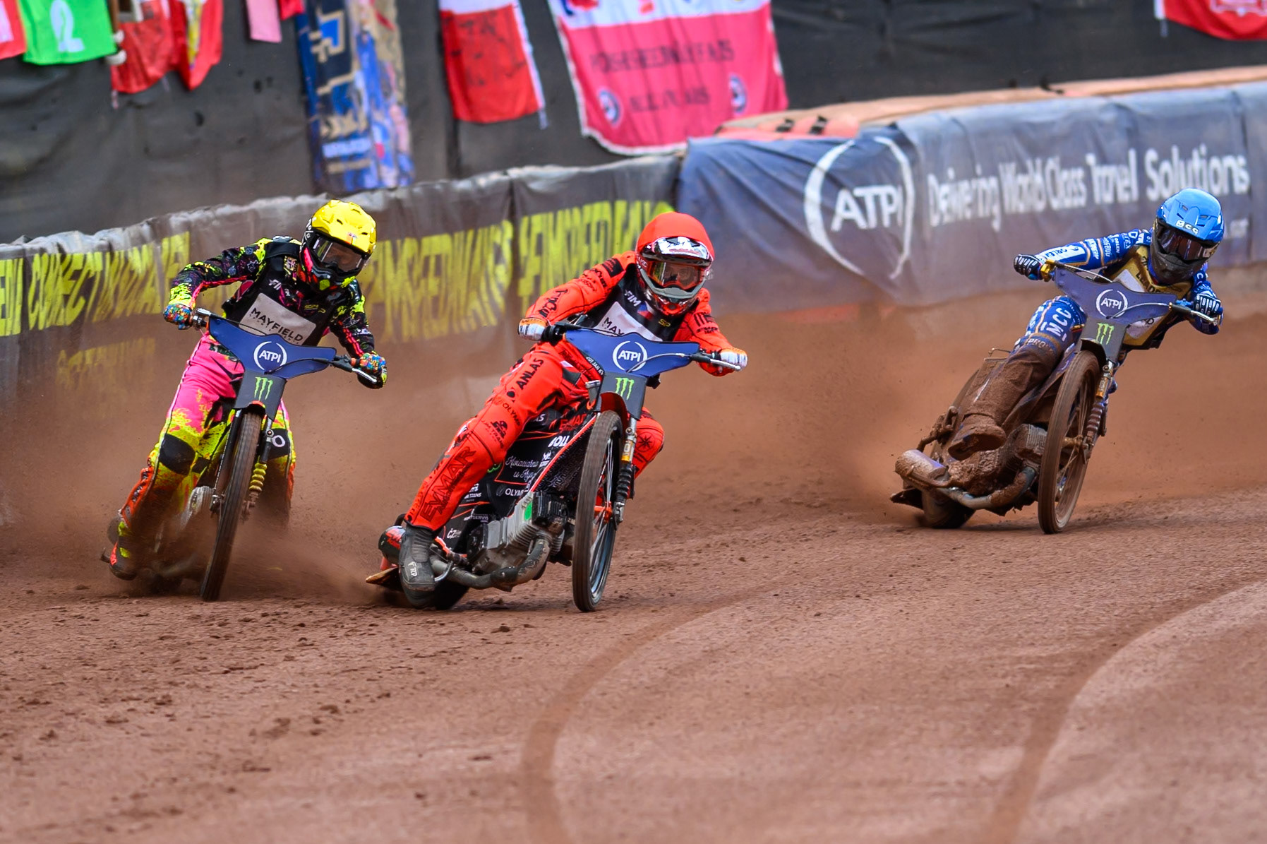 Jan Kvech (201) of Czech Republic in Red leading Michael Jepsen Jensen (52) of Denmark in Yellow and Bartosz Zmarzlik (95) of Poland in Blue during the ATPI  FIM Speedway GP of Manchester at the National Speedway Stadium, Manchester on Saturday 6th June 2026. (Photo: Ian Charles | MI News)