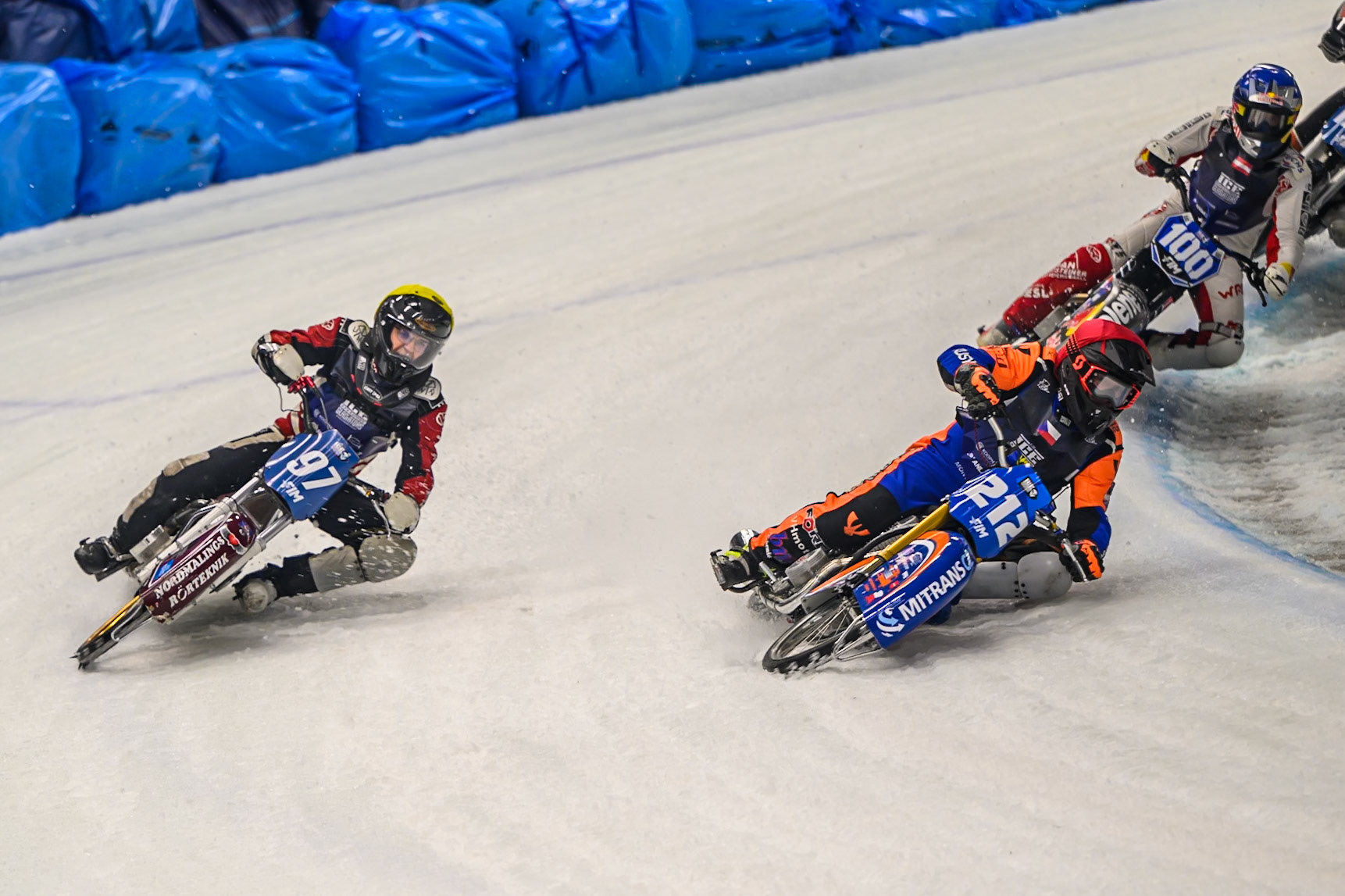 Lukas Hutla (212) of Czechia  in Red rides inside Ove Ledström (97) of Sweden  in Yellow with Franz Zorn (100) of Austria  in Blue behind during the Ice Speedway Gladiators World Championship Final 1 at Max-Aicher-Arena, Inzell on Saturday 14th March 2026. (Photo: Ian Charles | MI News)