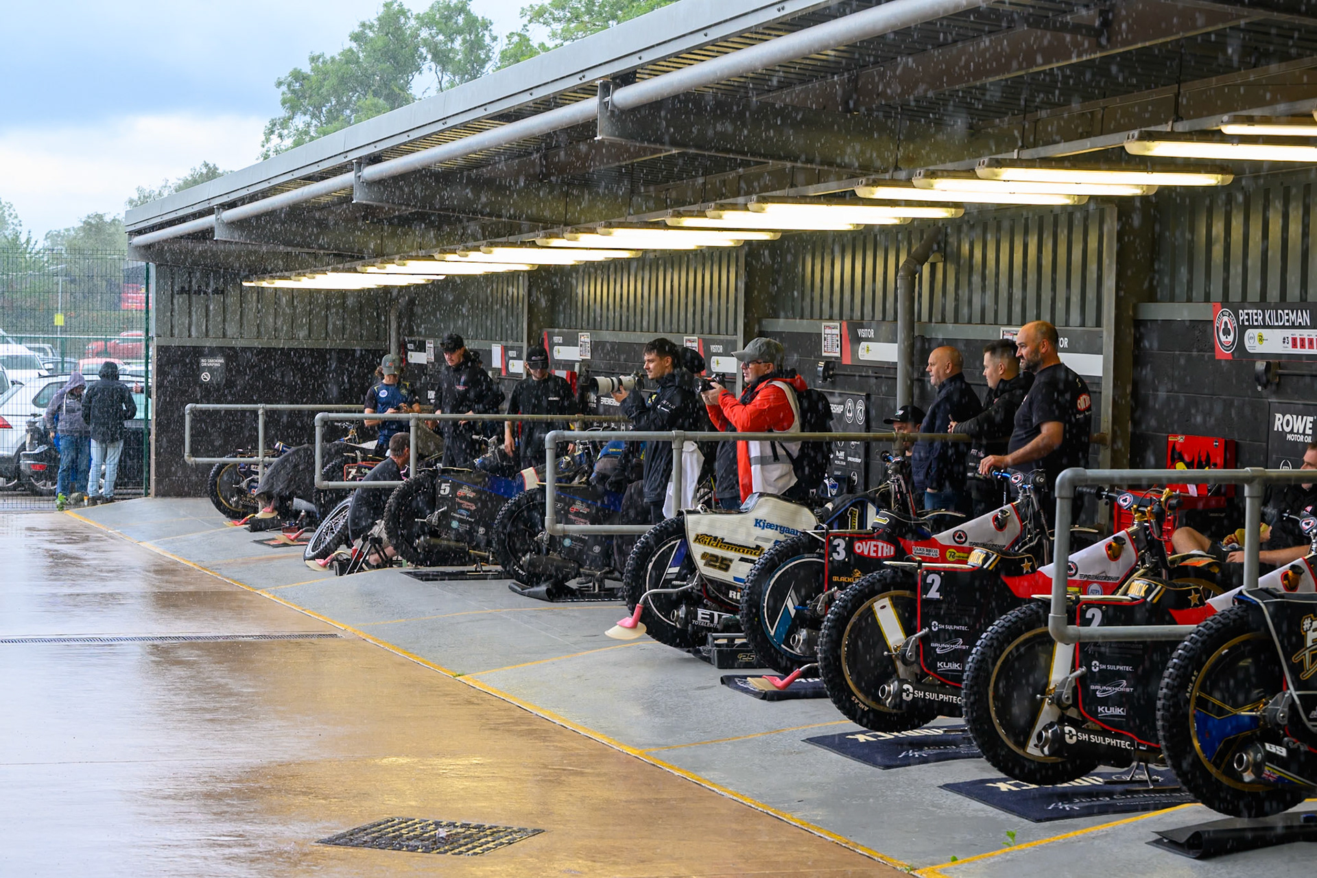 A sudden downpour hits the Stadium as riders and officials shelter from the downpour during the Rowe Motor Oil Premiership match between Belle Vue Aces and Sheffield Tigers at the National Speedway Stadium, Manchester on Monday 31st August 2026. (Photo: Ian Charles | MI News)