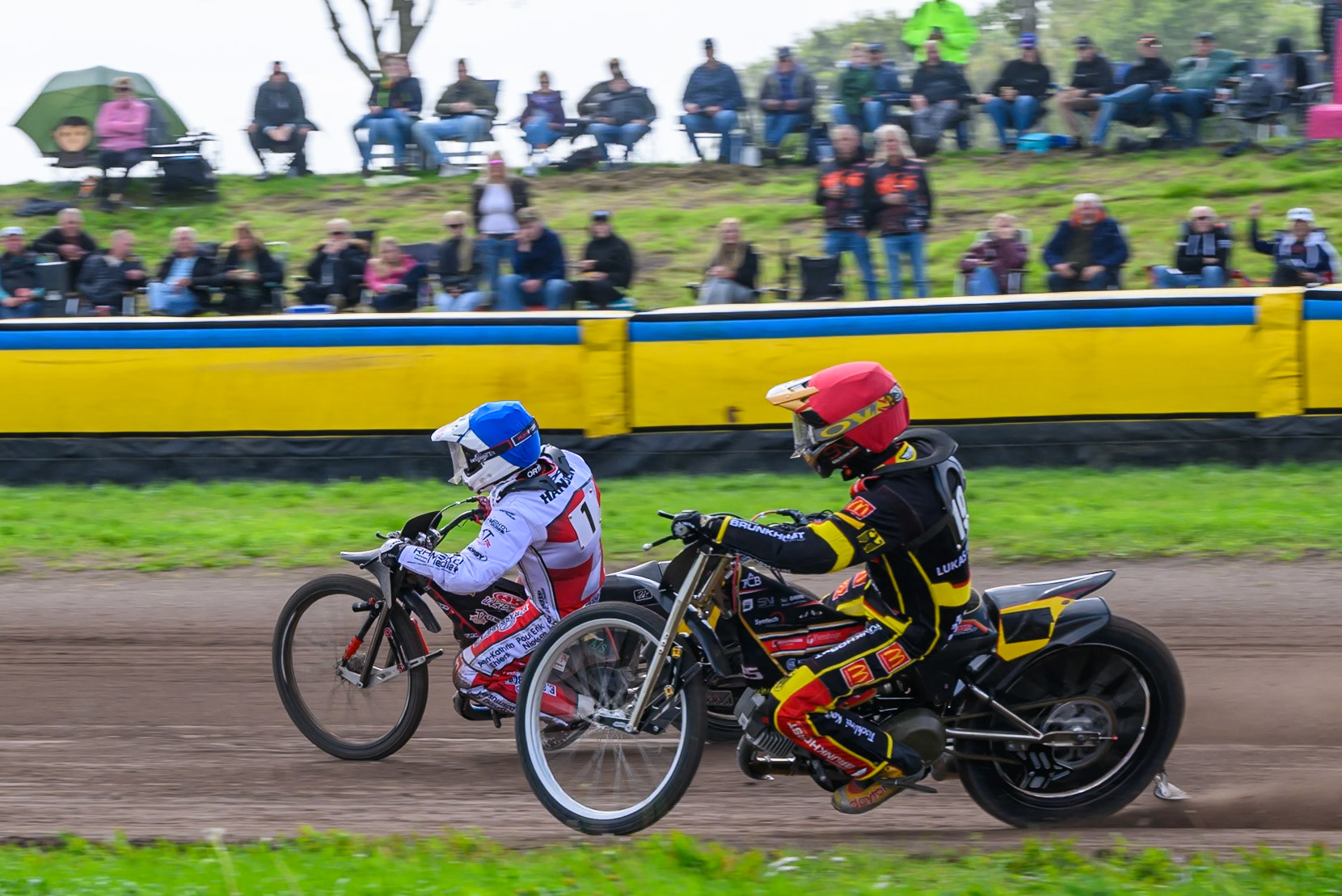 Kenneth Kruse Hansen (1) of Denmark in Blue rides outside Lukas Fienhage (19) of Germany in Red during the FIM Long Track of Nations 2026 at the Speed Centre Roden in the Netherlands on Sunday 20th September 2026. (Photo: Ian Charles | MI News)