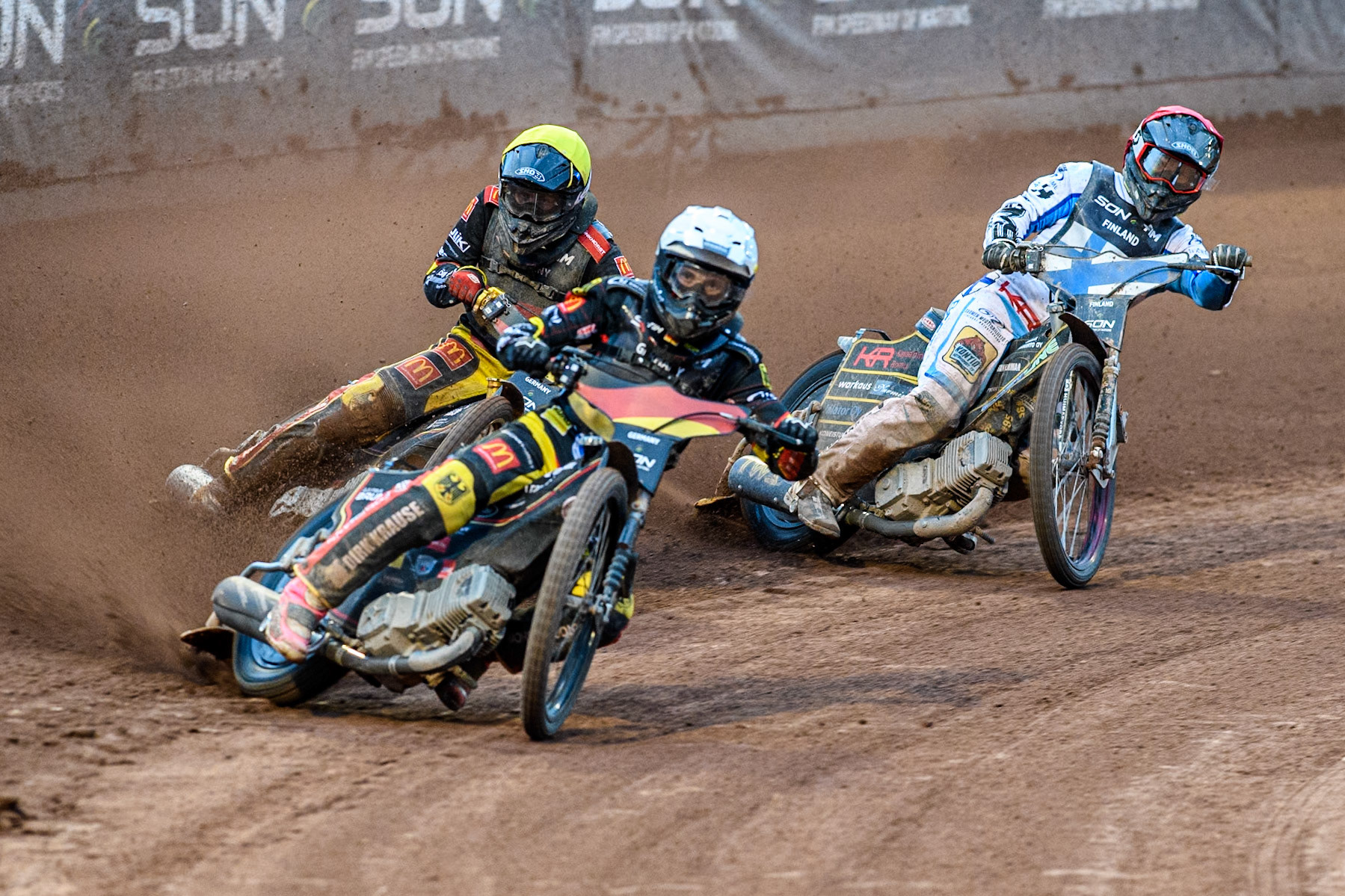 Kai Huckenbeck of Germany in White and Norick Blödorn of Germany in Yellow leading Antti Vuolas of Finland in Blue during the Monster Energy FIM Speedway of Nations Semi-Final 1 at the National Speedway Stadium, Manchester on Tuesday 9th July 2024. (Photo: Ian Charles | MI News)