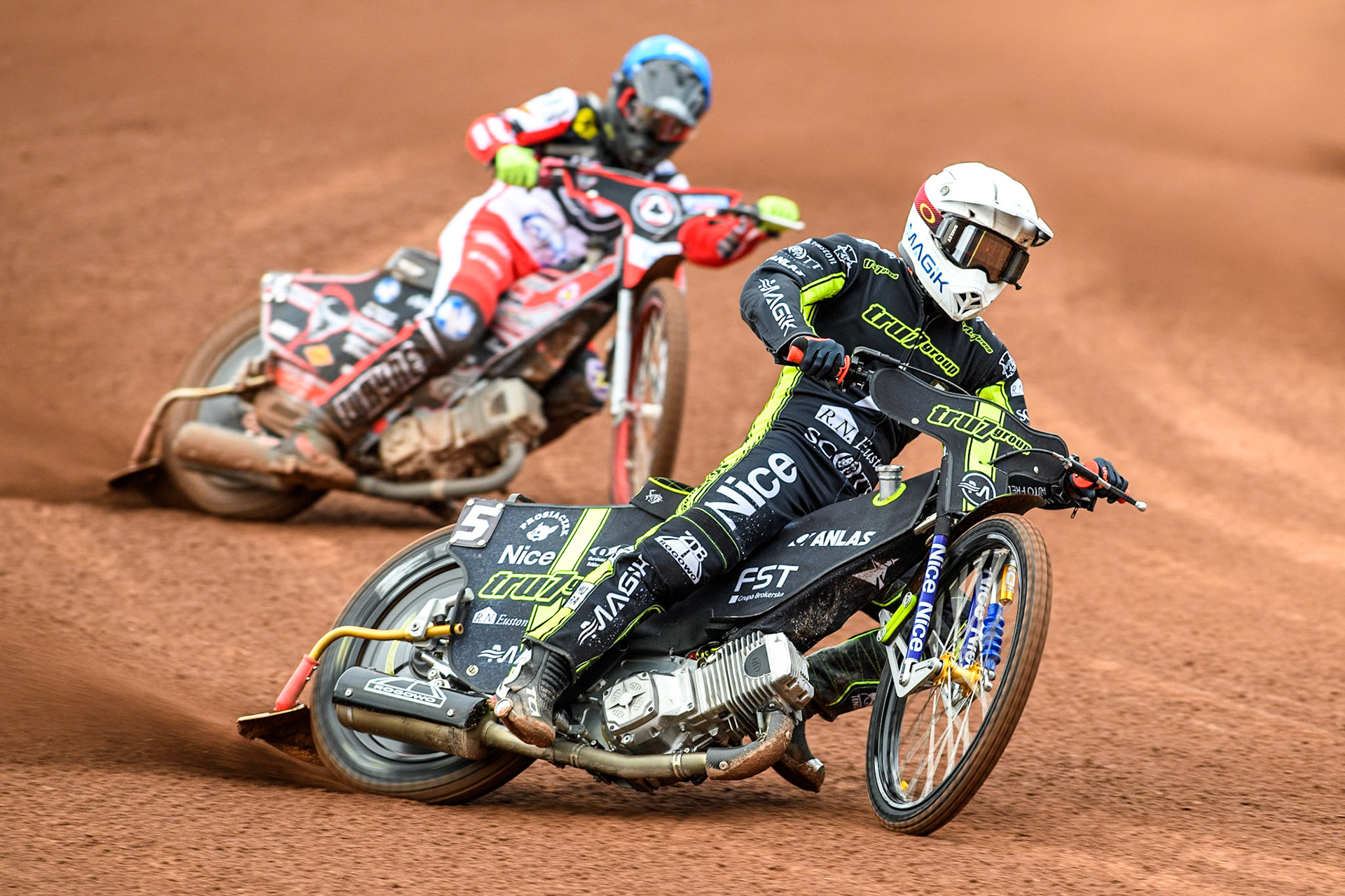 Ipswich Witches' Emil Sayfutdinov in White leading Belle Vue Aces' Connor Bailey  in Blue during the Rowe Motor Oil Premiership match between Belle Vue Aces and Ipswich Witches at the National Speedway Stadium, Manchester on Monday 1st July 2024. (Photo: Ian Charles | MI News)