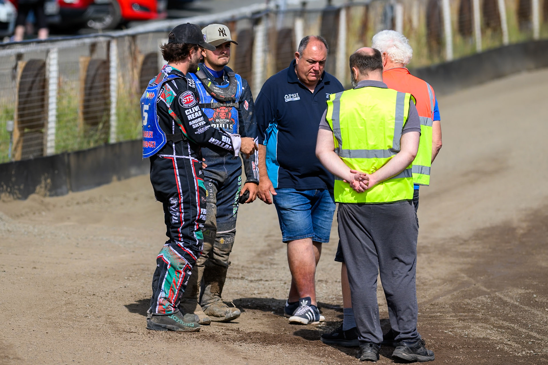 (L to R) Alfie Bowtell of Buxton Bulls, Nathan Ablitt, Guest Rider for Buxton Bulls  and Jason Pipe, Team Manager of Kings Lynn Young Stars discuss the condition of the track with the track staff during the WSRA National Development League match between Buxton Bulls and King's Lynn Young Stars at Hi-Edge Speedway, Buxton on Sunday 9th August 2026. (Photo: Ian Charles | MI News)