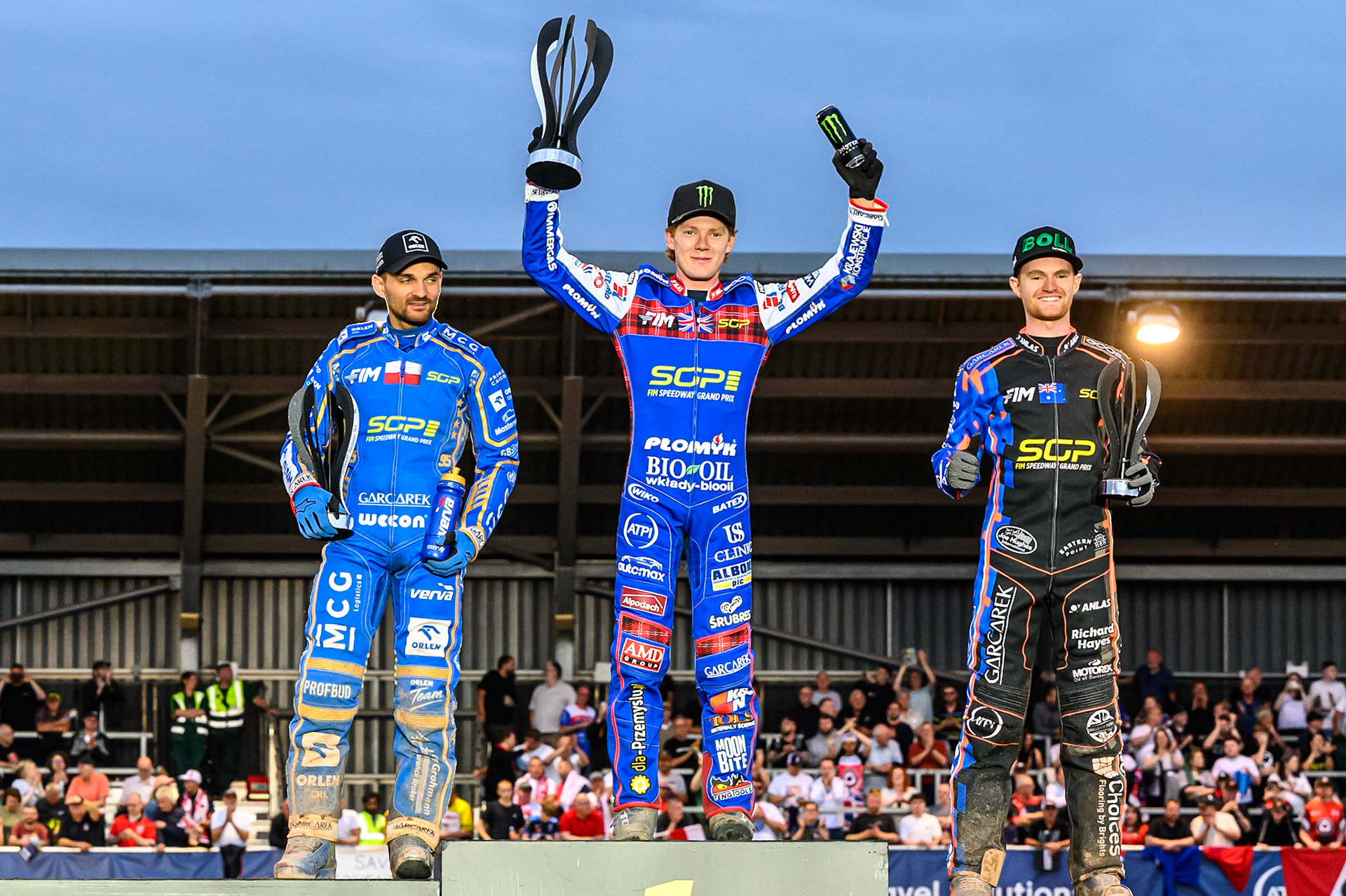 Top3: (L to R) Bartosz Zmarzlik (2nd), Dan Bewley (Winner) Brady Kurtz (3rd) during the ATPI FIM Speedway Grand Prix Round 4 at the National Speedway Stadium, Manchester, on Friday 13th June 2025. (Photo: Ian Charles | MI News)