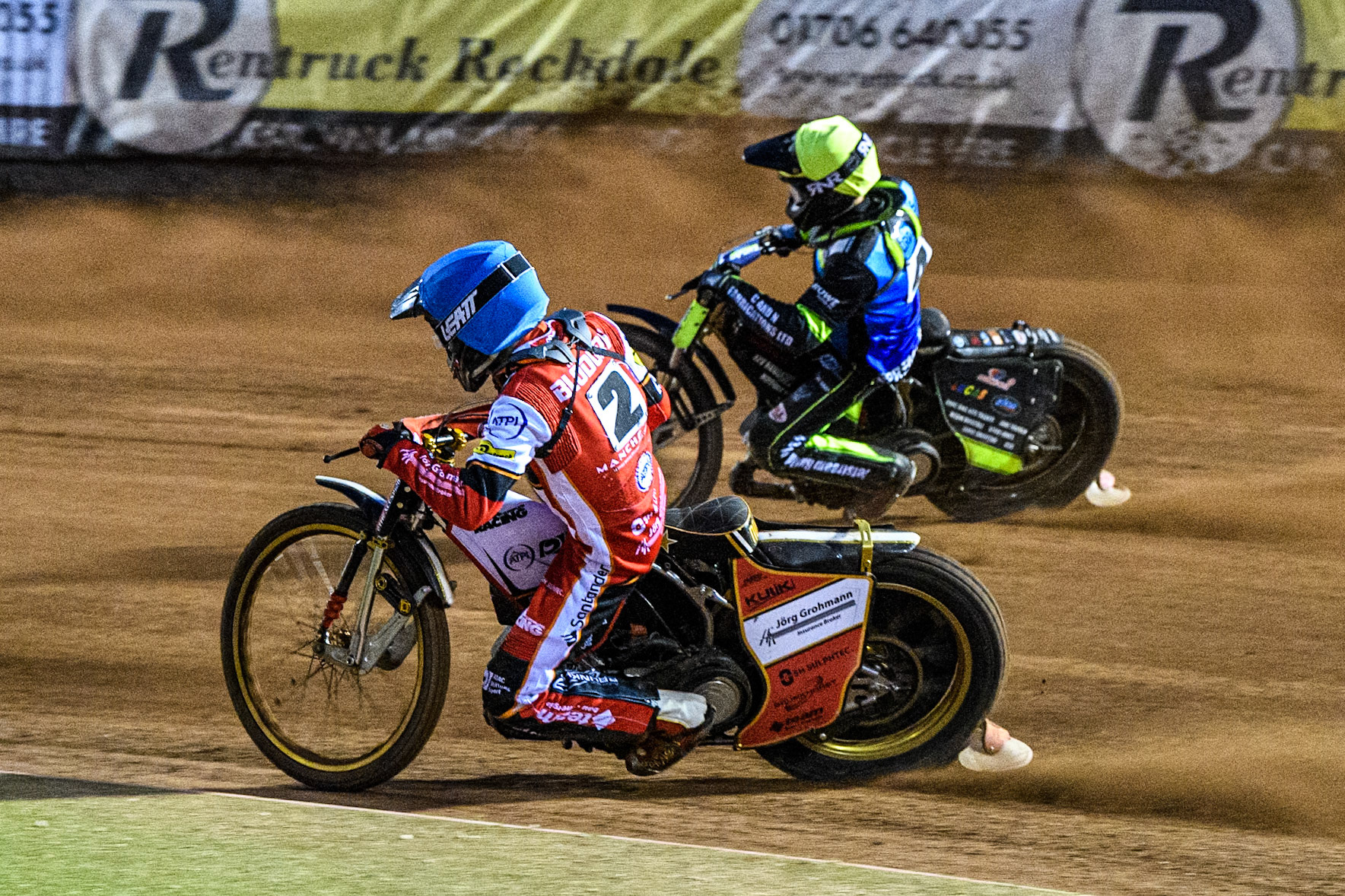 Belle Vue Aces' Norick Blodorn in Blue rides inside Oxford Spires' Guest Rider Dan Thompson in Yellow during the Rowe Motor Oil Premiership match between Belle Vue Aces and Oxford Spires at the National Speedway Stadium, Manchester on Monday 14th April 2025. (Photo: Ian Charles | MI News)