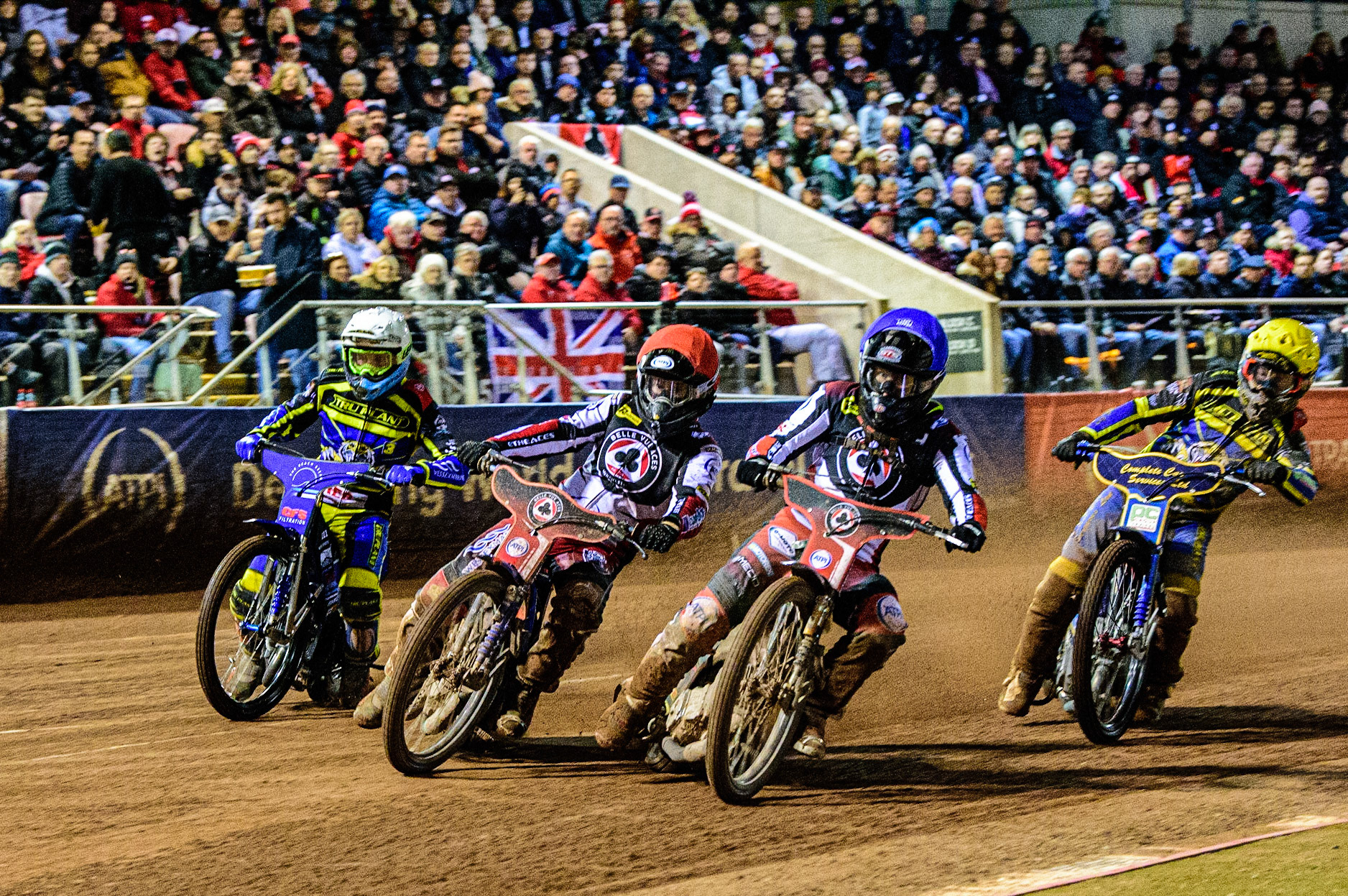 Brady Kurtz  (Red) and Tom Brennan  (Blue) go for maximum heat points ahead of Adam Ellis  (White) and Kyle Howarth  (Yellow) during the SGB Premiership Grand Final 1st leg between Belle Vue Aces and Sheffield Tigers at the National Speedway Stadium, Manchester on Monday 10th October 2022. (Credit: Ian Charles | MI News)