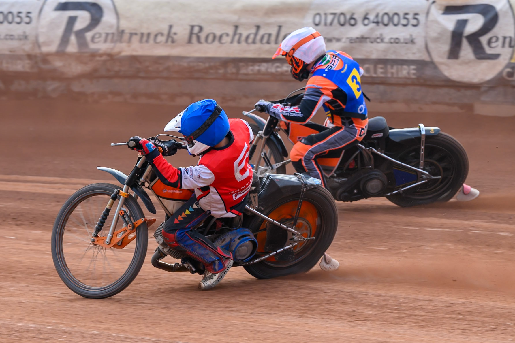 Belle Vue Colts' Harry Fletcher in Blue on the inside of Monarchs' Connor Coles in White during the WSRA National Development League match between Belle Vue Aces and Edinburgh Academy at the National Speedway Stadium, Manchester on Sunday 12th October 2025. (Photo: Ian Charles | MI News)