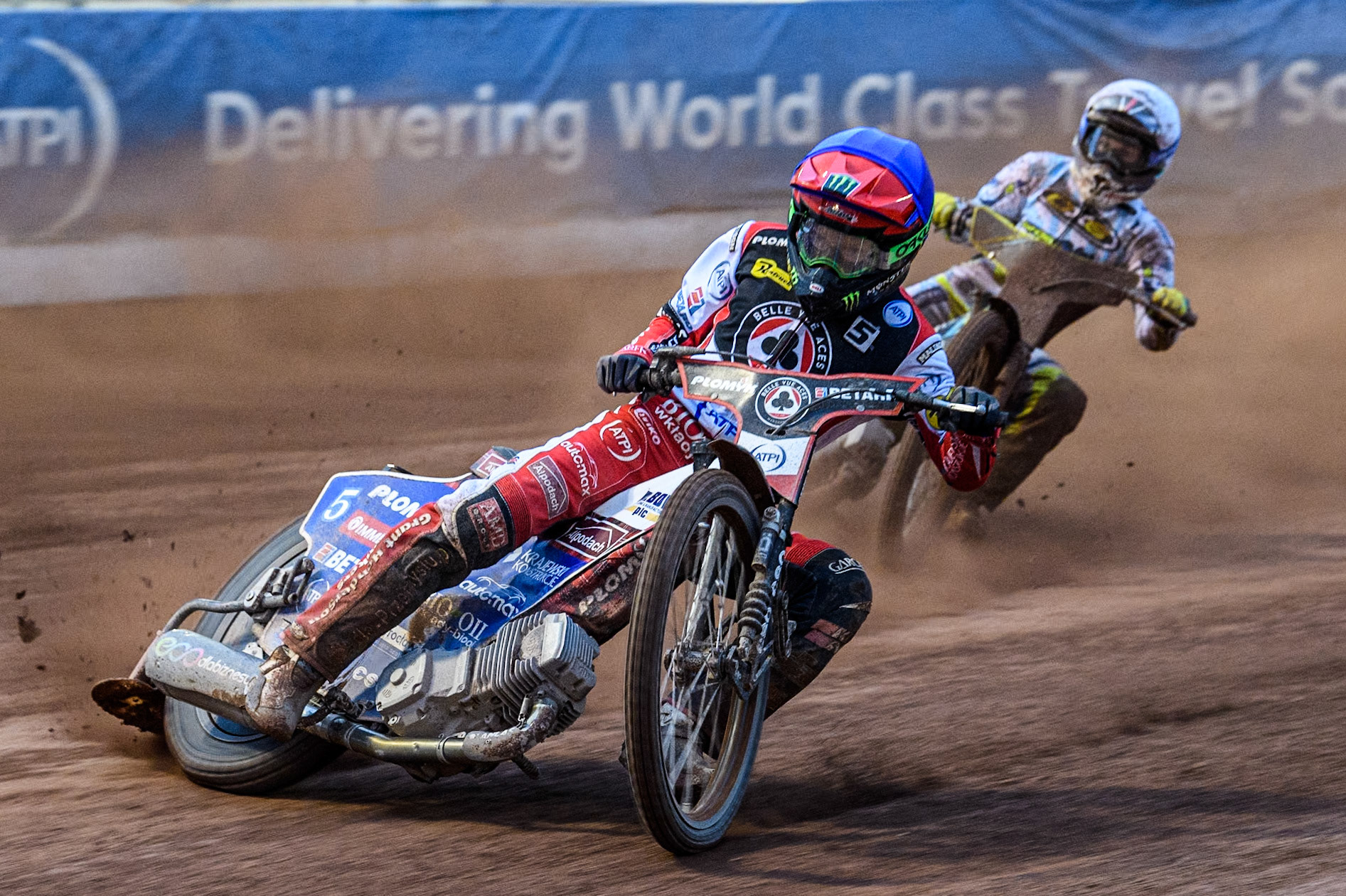 Belle Vue Aces' Dan Bewley in Blue leading Oxford Spires' Rohan Tungate in White during the Rowe Motor Oil Premiership match between Belle Vue Aces and Oxford Spires at the National Speedway Stadium, Manchester on Monday 13th May 2024. (Photo: Ian Charles | MI News)