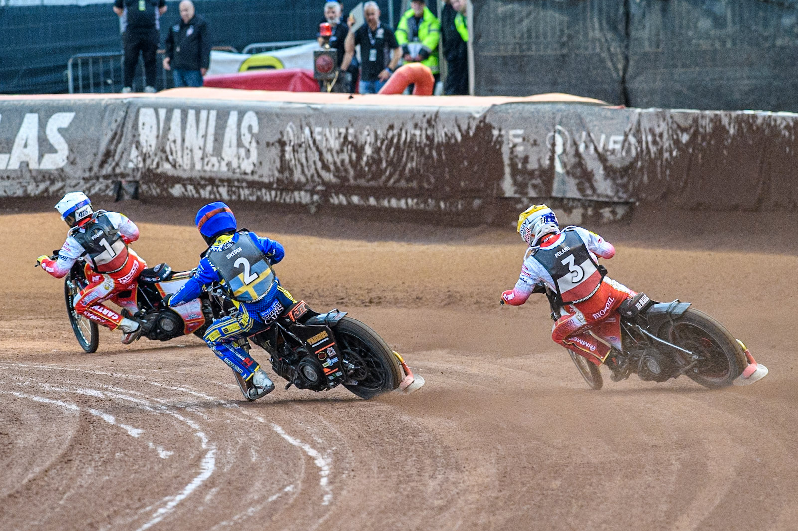 Maciej Janowski of Poland in Yellow chases Jacob Thorssell of Sweden in Blue and Dominik Kubera of Poland in White during the Monster Energy FIM Speedway of Nations Semi-Final 1 at the National Speedway Stadium, Manchester on Tuesday 9th July 2024. (Photo: Ian Charles | MI News)