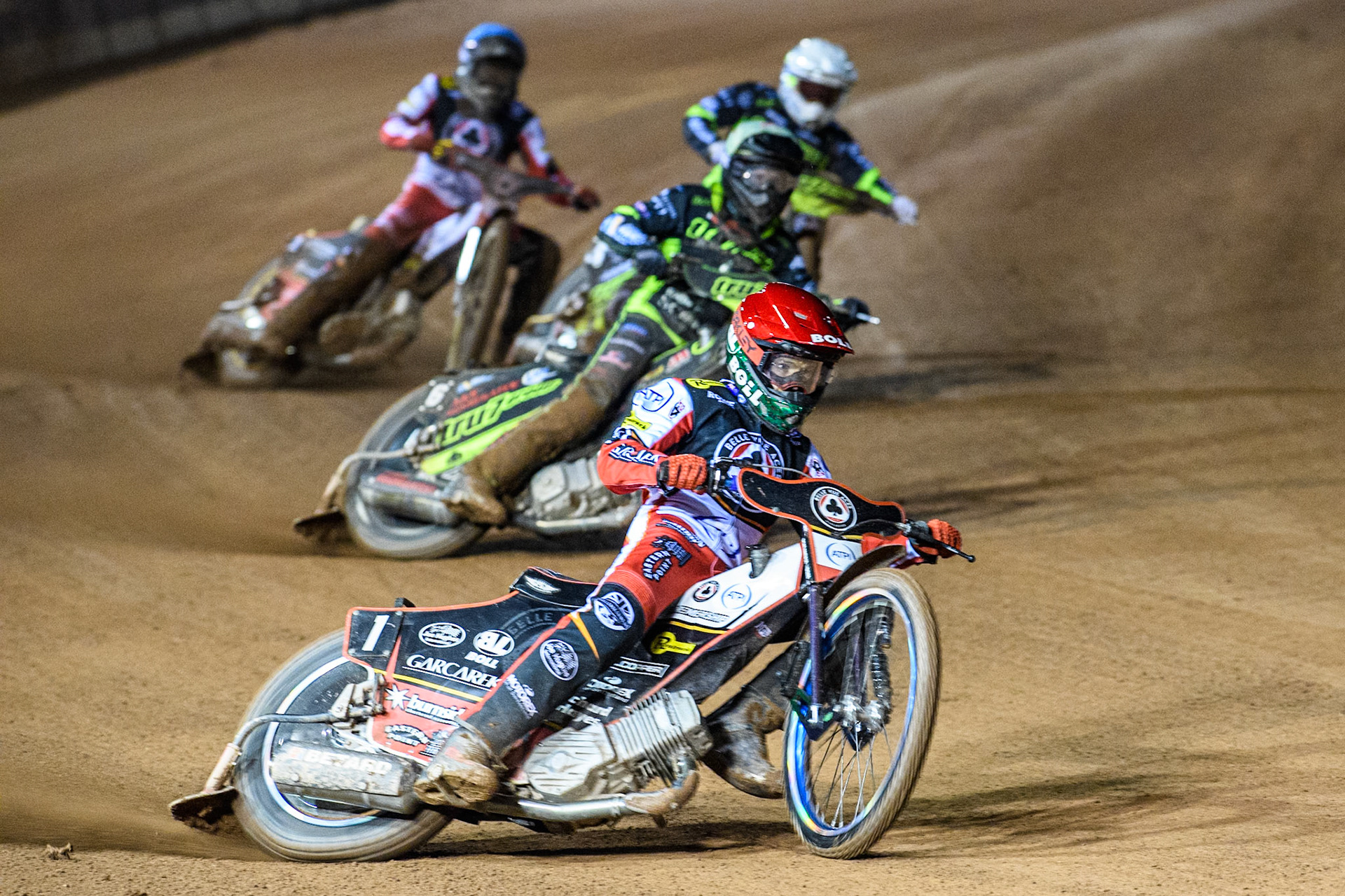 Brady Kurtz of Belle Vue Aces in Red leading Dan Thompson of Ipswich Witches in Yellow, Emil Sayfutdinov of Ipswich Witches in White and Norick Blödorn of Belle Vue Aces in Blue during the Premiership Cup Quarter Final 1st Leg match between Belle Vue Aces and Ipswich Witches at the National Speedway Stadium, Manchester on Monday 24th March 2025. (Photo: Ian Charles | MI News)
