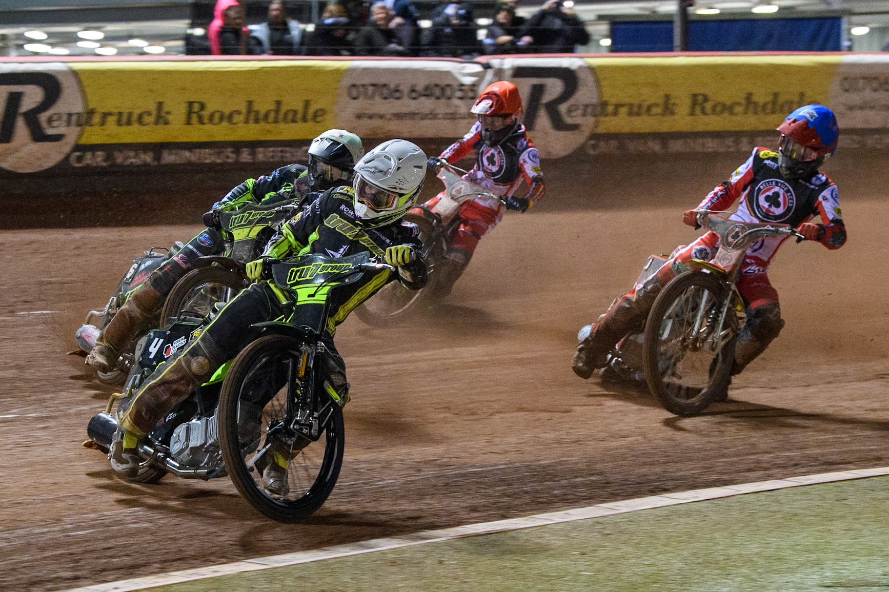 Tom Brennan of Ipswich Witches in White leading Dan Thompson of Ipswich Witches in Yellow, Tate Zischke of Belle Vue Aces  in Blue and Zach Cook of Belle Vue Aces in Red during the Premiership Cup Quarter Final 1st Leg match between Belle Vue Aces and Ipswich Witches at the National Speedway Stadium, Manchester on Monday 24th March 2025. (Photo: Ian Charles | MI News)