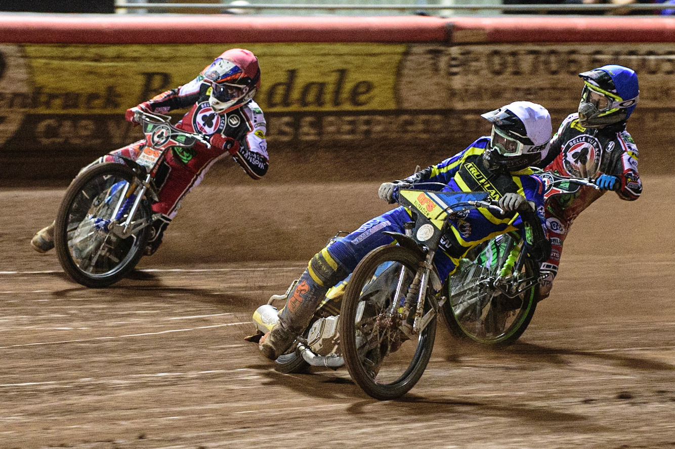 MANCHESTER, UK. OCT 7TH  Adam Ellis  (White) leads Steve Worrall   (Red) and Charles Wright (Blue) during the SGB Premiership Play off Semi-Final Second Leg between Belle Vue Aces and Sheffield Tigers at the National Speedway Stadium, Manchester on Thursday 7th October 2021. (Credit: Ian Charles | MI News)