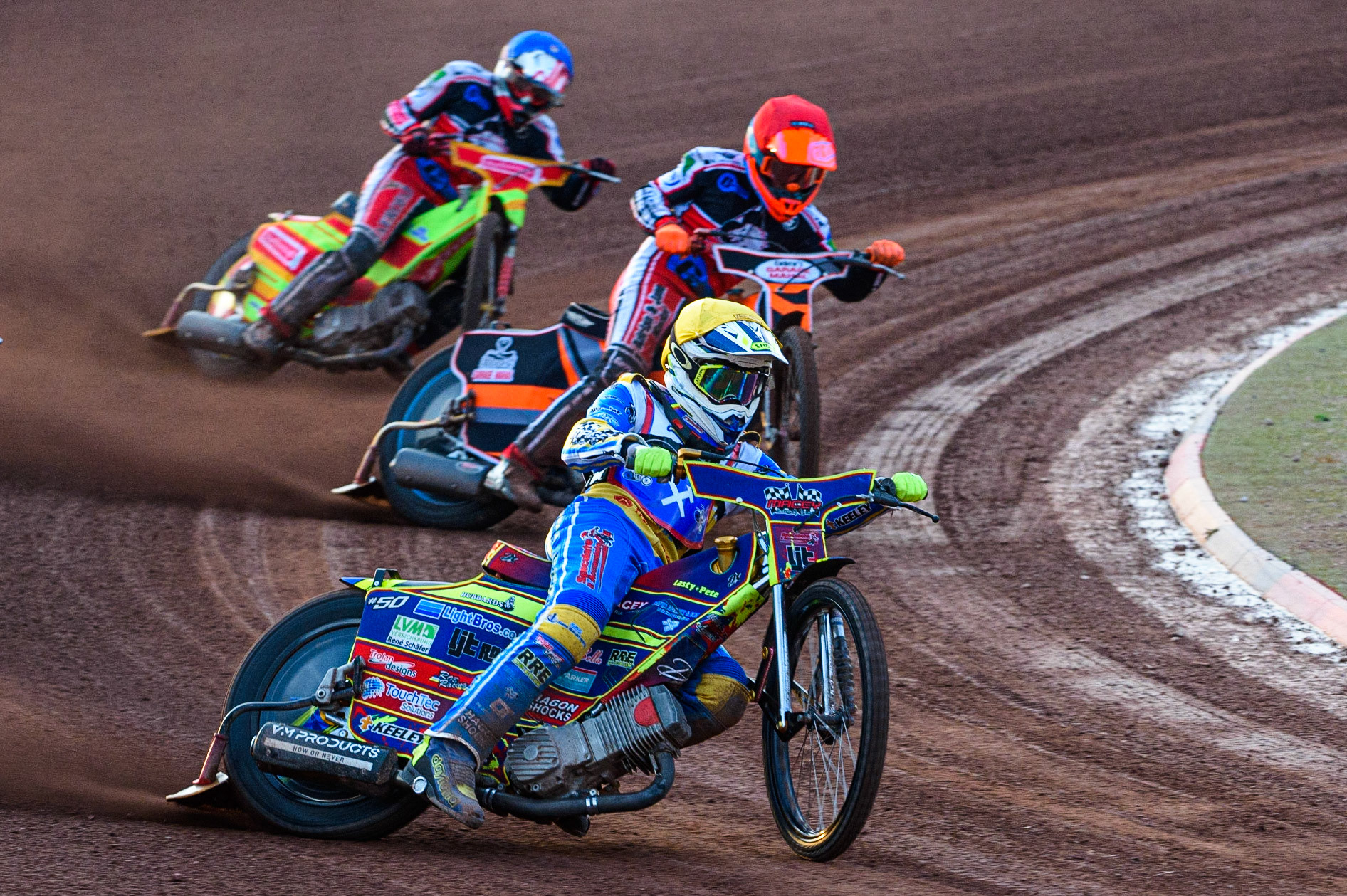 MANCHESTER, UK. JULY 23RD  Nathan Ablitt  (Yellow) leads Connor Coles  (Red) and Ben Woodhull  (Blue)during the National Development League match between Belle Vue Colts and Eastbourne Seagulls at the National Speedway Stadium, Manchester on Friday 23rd July 2021. (Credit: Ian Charles | MI News)