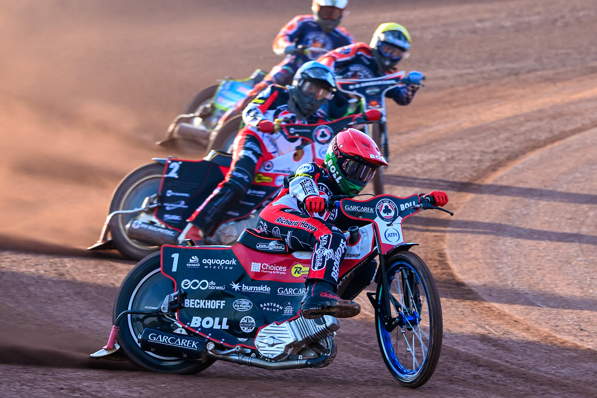 Brady Kurtz of Belle Vue Aces in Red leading Norick Blodorn of Belle Vue Aces in Blue ,Kye Thomson of Northampton Foxes in Yellow  and Jaimon Lidsey of Northampton Foxes  in White during the Rowe Motor Oil Premiership match between Belle Vue Aces and Northampton Foxes at the National Speedway Stadium, Manchester on Monday 13th July 2026. (Photo: Ian Charles | MI News)