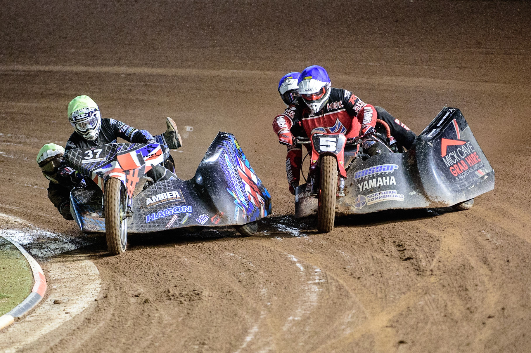 MANCHESTER, UK. OCT 30TH   Mark Cossar &amp; Gareth Williams  (Yellow) forces his way past Mick Cave &amp; Bradley Steer  (Blue) during the Manchester Masters Sidecar Speedway and Flat Track Racing at the National Speedway Stadium, Manchester on Saturday 30th October 2021. (Credit: Ian Charles | MI News)