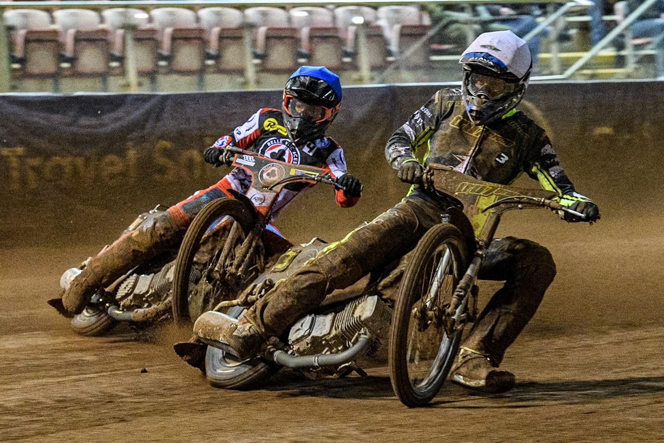 Ipswich Witches' Adam Ellis in White leading Belle Vue Aces' Ben Cook in Blue during the Rowe Motor Oil Premiership match between Belle Vue Aces and Ipswich Witches at the National Speedway Stadium, Manchester on Monday 22nd April 2024. (Photo: Ian Charles | MI News)