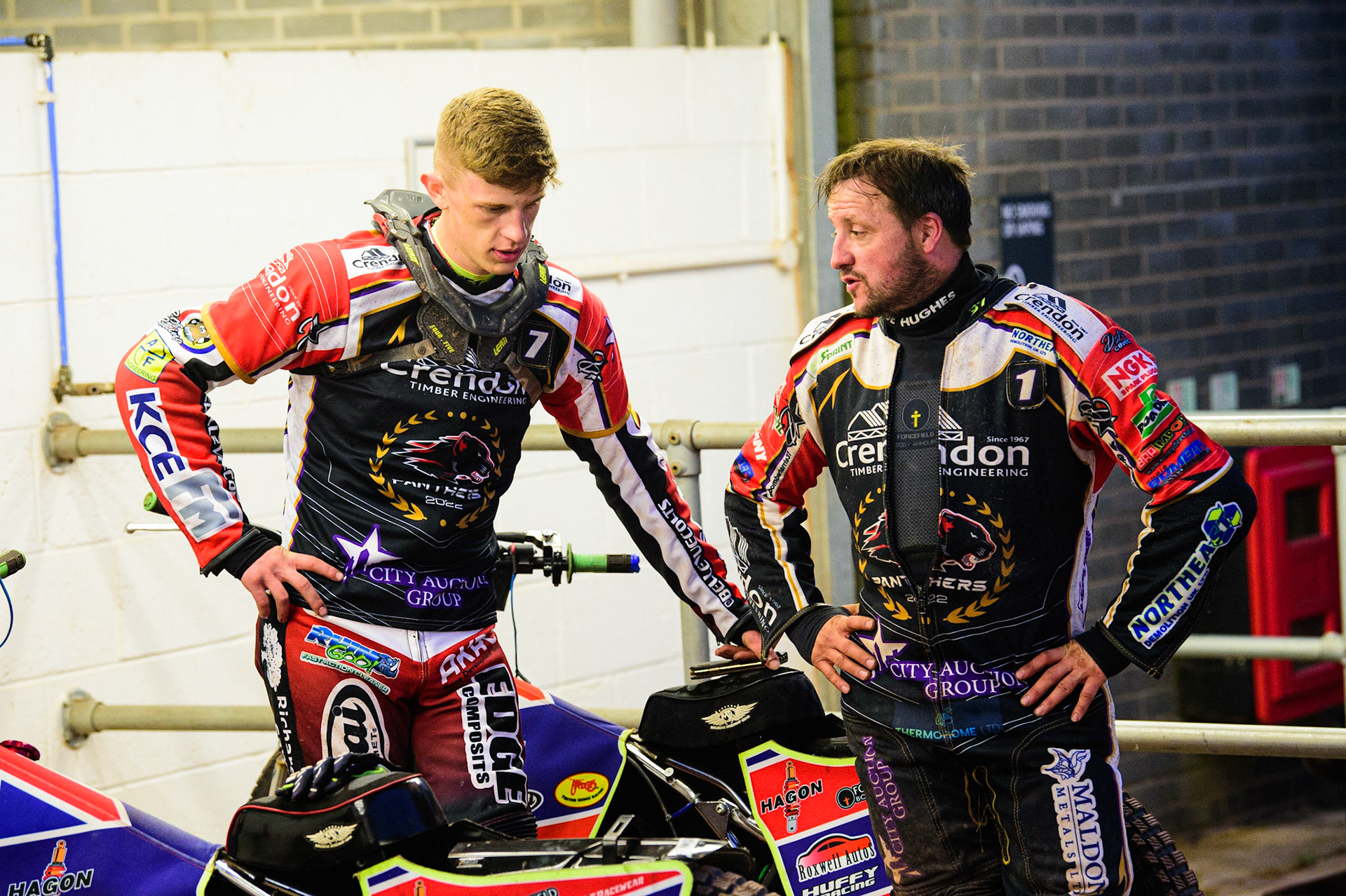 Jake Mulford  (left) chats with Chris Harris  during the SGB Premiership match between Belle Vue Aces and Peterborough at the National Speedway Stadium, Manchester on Monday 25th July 2022. (Credit: Ian Charles | MI News