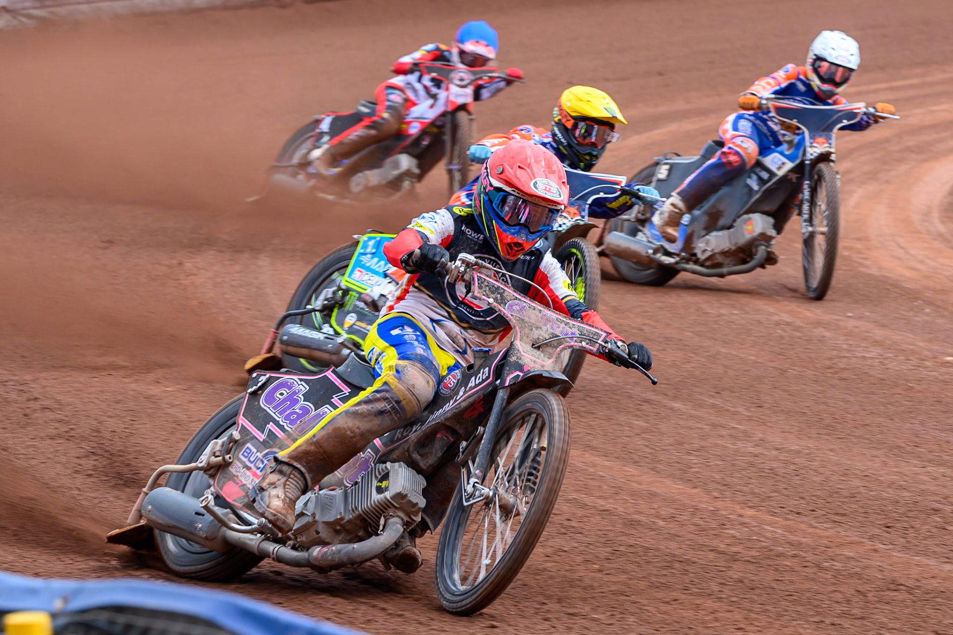 Leon Flint, Guest Rider for Belle Vue Aces in Red leading Jaimon Lidsey of Northampton Foxes  in Yellow, Nicolai Klindt of Northampton Foxes in White and Zach Cook of Belle Vue Aces in Blue during the Rowe Motor Oil Premiership match between Belle Vue Aces and Northampton Foxes at the National Speedway Stadium, Manchester on Monday 4th May 2026. (Photo: Ian Charles | MI News)