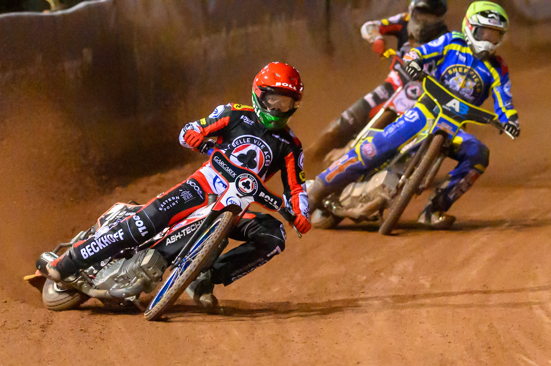 Brady Kurtz of Belle Vue Aces in Red leading Jye Etheridge of Sheffield Tigers    in Yellow during the Knockout Cup, Northern Section match between Belle Vue Aces and Sheffield Tigers at the National Speedway Stadium, Manchester on Monday 30th March 2026. (Photo: Ian Charles | MI News)
