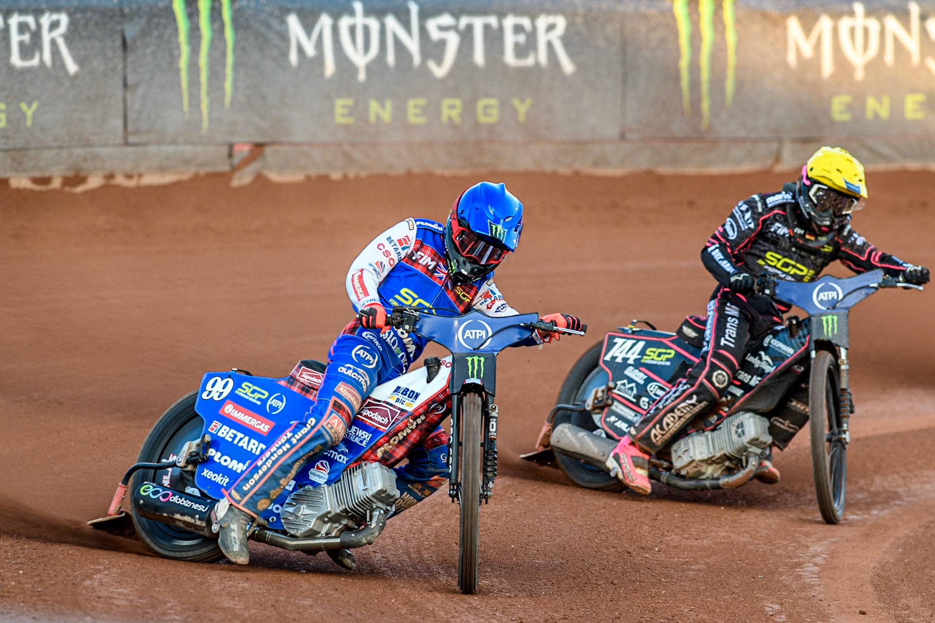 Dan Bewley (99) of Great Britain in Blue leading Kai Huckenbeck (744) of Germany in Yellow during the ATPI FIM Speedway Grand Prix Round 5 at the National Speedway Stadium, Manchester, on Saturday 14th June 2025. (Photo: Ian Charles | MI News)