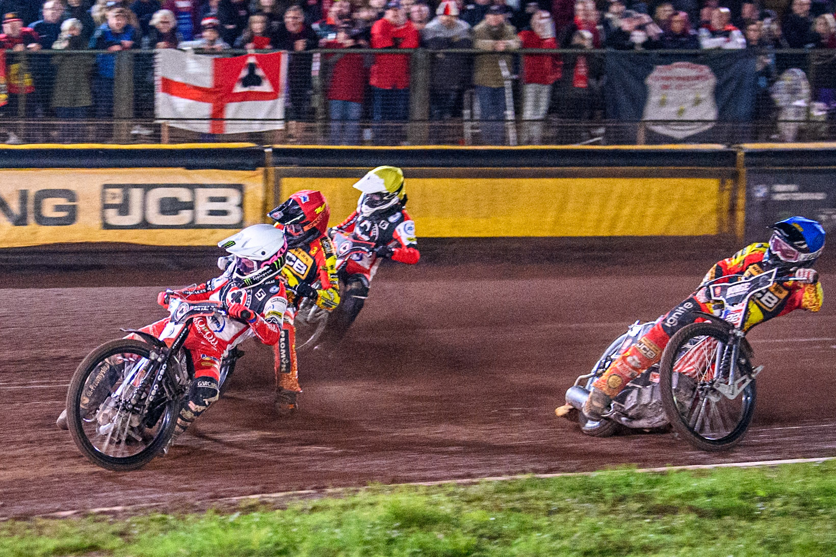 Belle Vue Aces' Dan Bewley in White rides inside Leicester Lions' Sam Masters in Red and Belle Vue Aces' Antti Vuolas in Yellow with Leicester Lions' Luke Becker in Blue behind during the Rowe Motor Oil Premiership Grand Final 2nd Leg between Leicester Lions and Belle Vue Aces at the Pidcock Motorcycles Arena, Leicester on Thursday 26th September 2024. (Photo: Ian Charles | MI News)