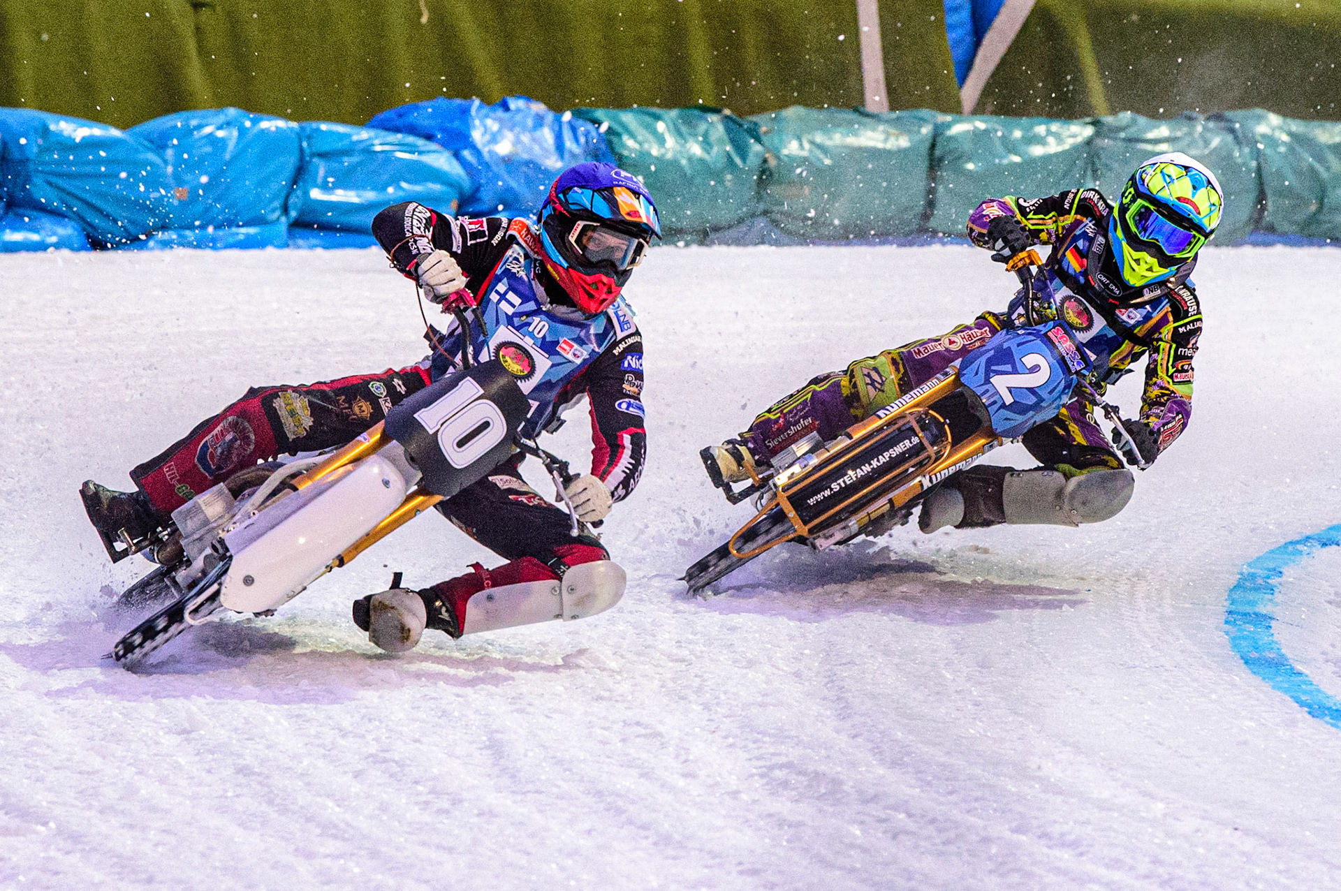 Topi Mustonen (Blue) outside Maximillian Neidermaier (White) during the German Individual Ice Speedway Championship at Horst-Dohm-Eisstadion, Berlin on Friday 3rd March 2023. (Photo: Ian Charles | MI News)