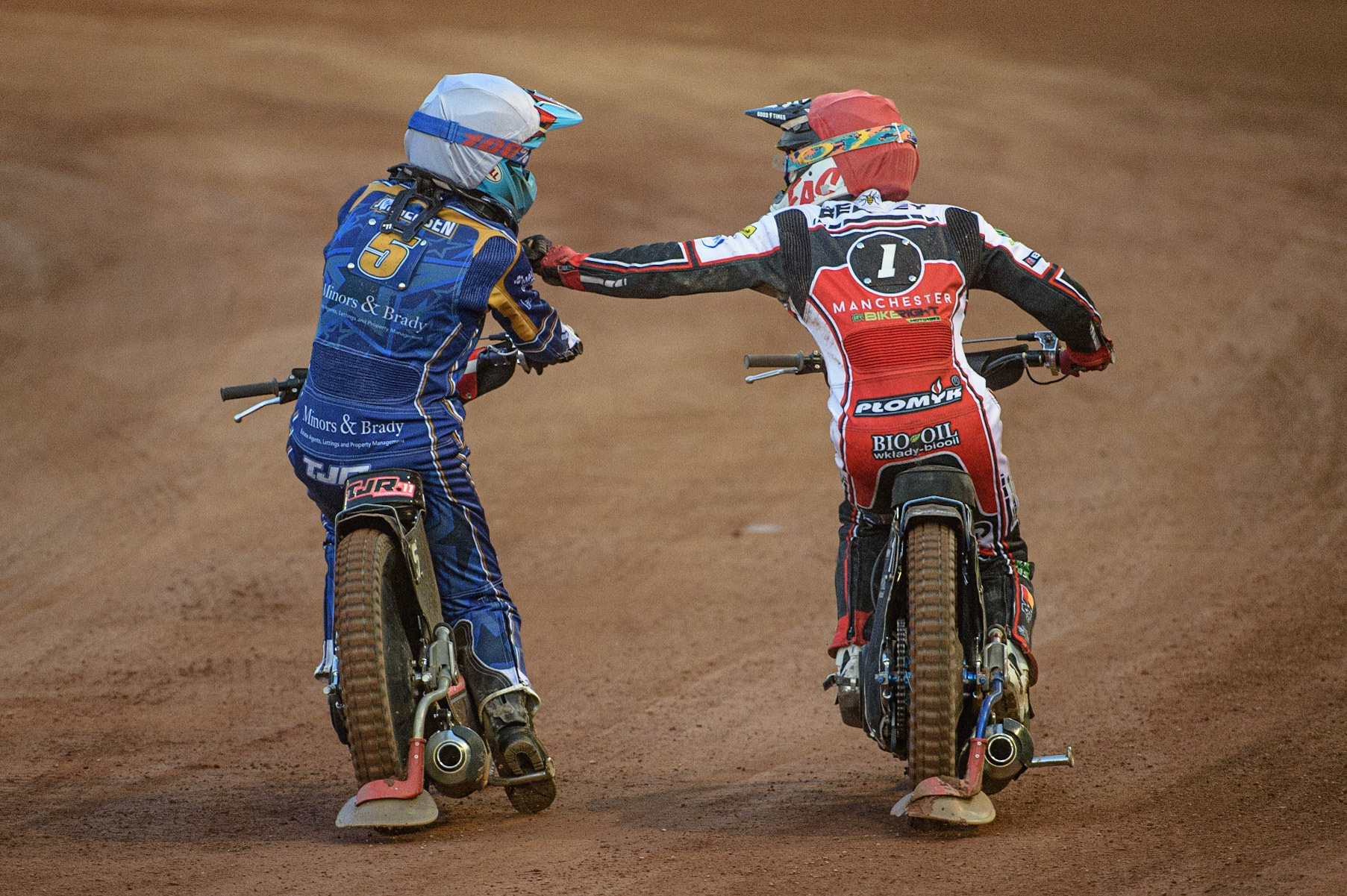 MANCHESTER, UK. AUGUST 23RD    Thomas Jorgensen  (White) congratulates Dan Bewley  (Red) on his win during the SGB Premiership match between Belle Vue Aces and King's Lynn Stars at the National Speedway Stadium, Manchester on Monday 23rd August 2021. (Credit: Ian Charles | MI News)