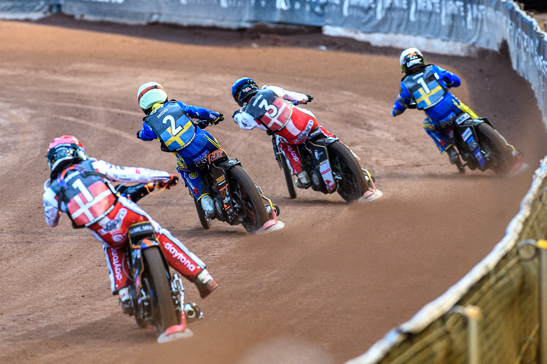 Mikkel Michelsen of Denmark in Red chases Jacob Thorssell of Sweden in Yellow, Rasmus Jensen of Denmark in Blue and Fredrik Lindgren of Sweden in White during the Monster Energy FIM Speedway of Nation Final at the National Speedway Stadium, Manchester on Saturday 13th July 2024. (Photo: Ian Charles | MI News)