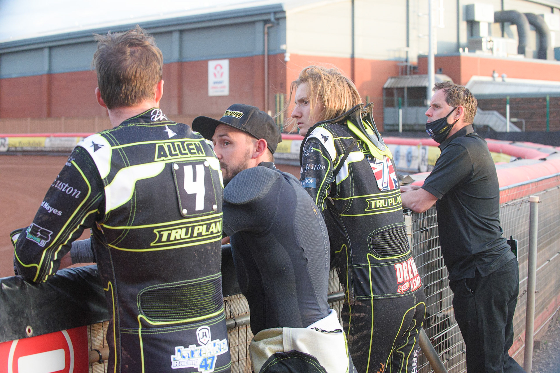 MANCHESTER, UK. JUNE 7TH   (l;-r) Jake Allen , Danny King, Drew Kemp  and team manager Chris Louis watch the track preparation during the SGB Premiership match between Belle Vue Aces and Ipswich Witches at the National Speedway Stadium, Manchester on Monday 7th June 2021. (Credit: Ian Charles | MI News)