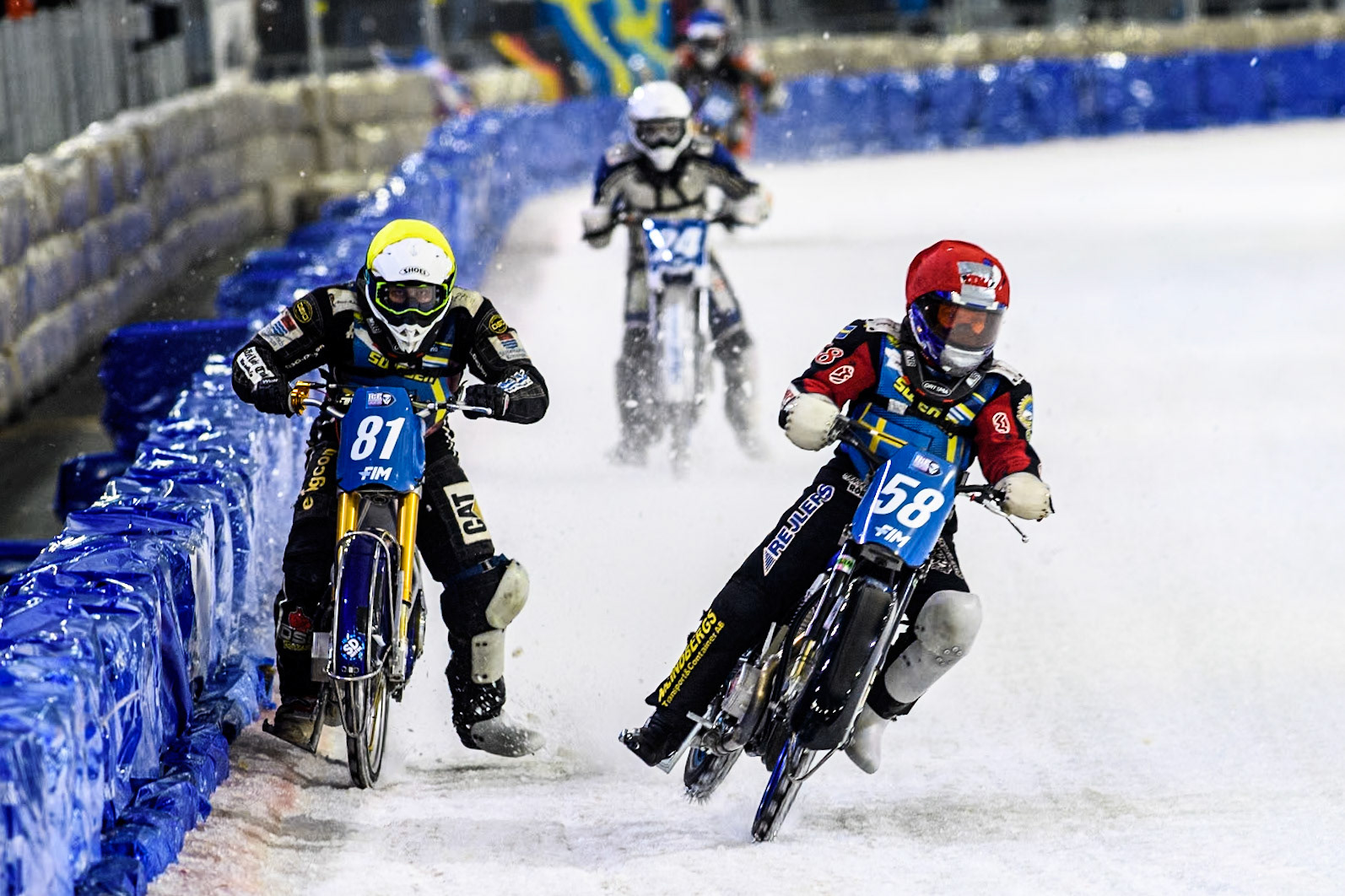 Sweden's Stefan Svensson (58) in Red rides inside Sweden"s Jimmy Olsén (81) in Yellow with Finland's Max Koivula (24) in White behind during the FIM Ice Speedway Gladiators World Championship Final 4 at Ice Rink Thialf, Heerenveen on Sunday 7th April 2024. (Photo: Ian Charles | MI News)