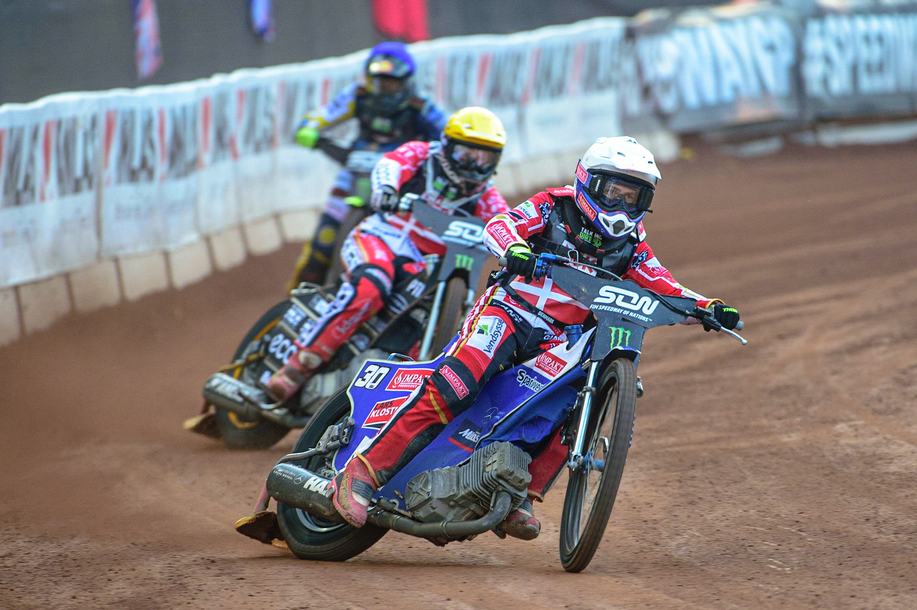 MANCHESTER, UK. OCT 16TH Leon Madsen of Denmark (White) leads Mads Hansen of Denmark (Yellow) and Philip Hellström-Bangs of Sweden (Blue) during the Monster Energy FIM Speedway of Nations at the National Speedway Stadium, Manchester on Saturday  16th October 2021. (Credit: Ian Charles | MI News)