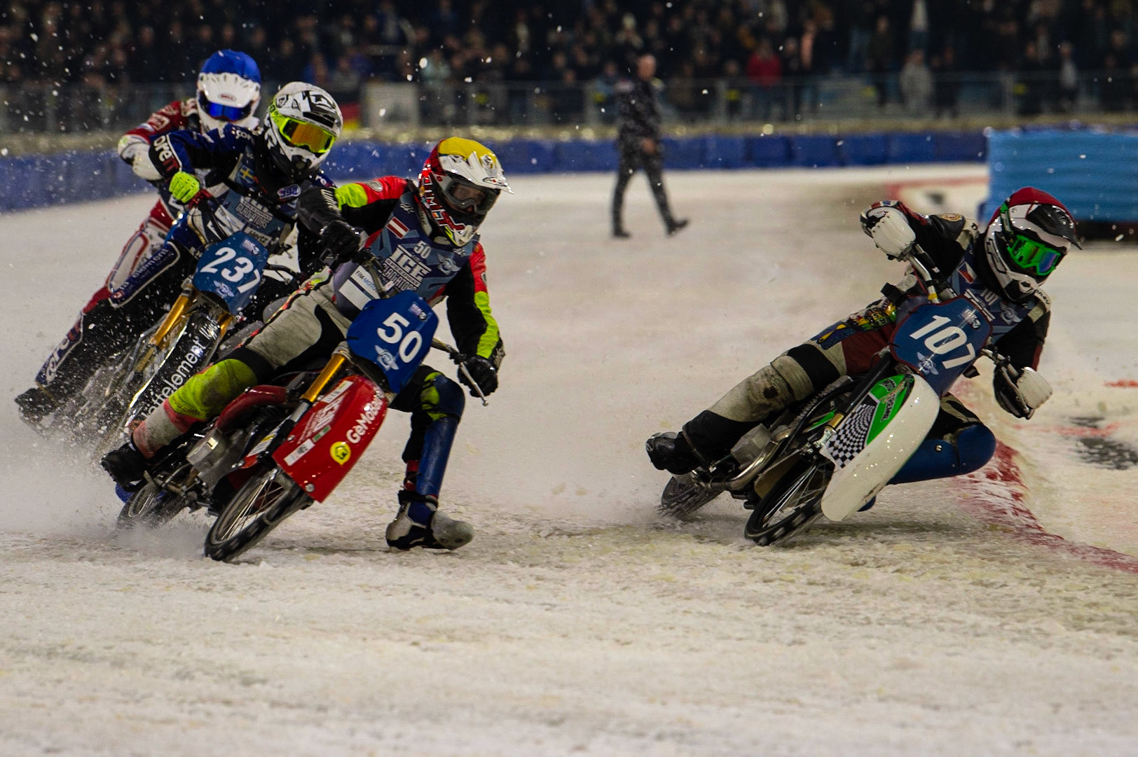 HEERENVEEN, NL. Andrej Divis (107) (Red) inside Harald Simon (50) (Yellow) with Jimmy Hörrnell (237)  (White) and Niek Schaap (412) (Blue) behind during the FIM Ice Speedway Gladiators World Championship Final 3 at Ice Rink Thialf, Heerenveen on Saturday  2 April 2022. (Credit: Ian Charles | MI News)