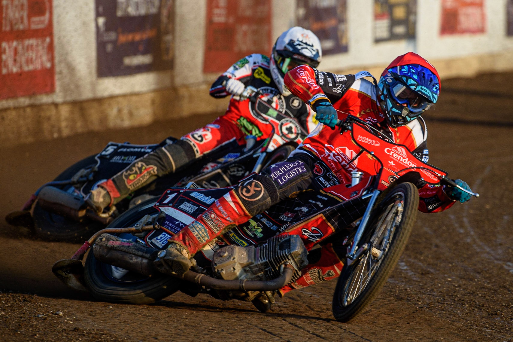 PETERBOROUGH, UK. JULY 19TH  Ulrich Ostergaard  (Red) leads Dan Bewley  (White) during the SGB Premiership match between Peterborough and Belle Vue Aces at East of England Showground, Peterborough on Monday 19th July 2021. (Credit: Ian Charles | MI News)