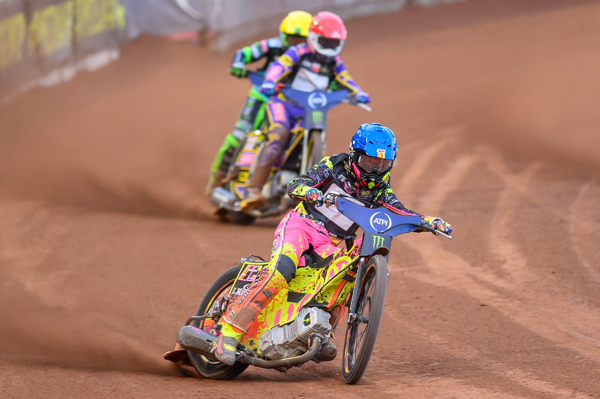 Michael Jepsen Jensen (52) of Denmark in Blue leading Kacper Woryna (223) of Poland in Red and Patryk Dudek (692) of Poland in Yellow during the ATPI  FIM Speedway GP of Manchester at the National Speedway Stadium, Manchester on Friday 5th June 2026. (Photo: Ian Charles | MI News)