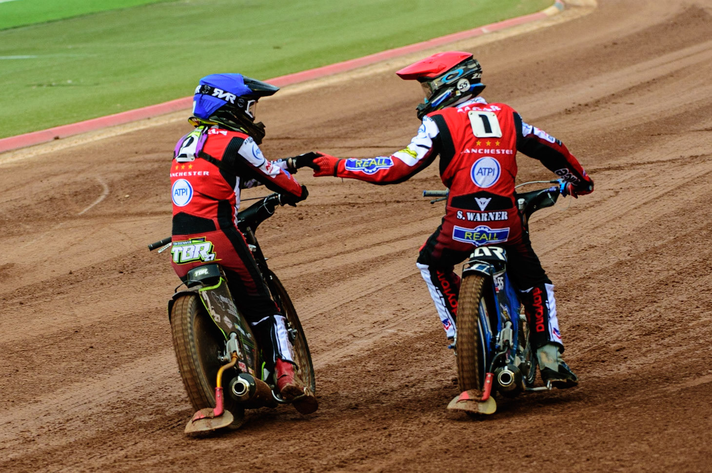 MANCHESTER UK  Tom Brennan  (Blue) and Matej Zagar  congratulate each other after their maximum heat win for The Aces during the SGB Premiership match between Belle Vue Aces and King's Lynn Stars at the National Speedway Stadium, Manchester on Monday 11th July 2022. (Credit: Ian Charles | MI News)