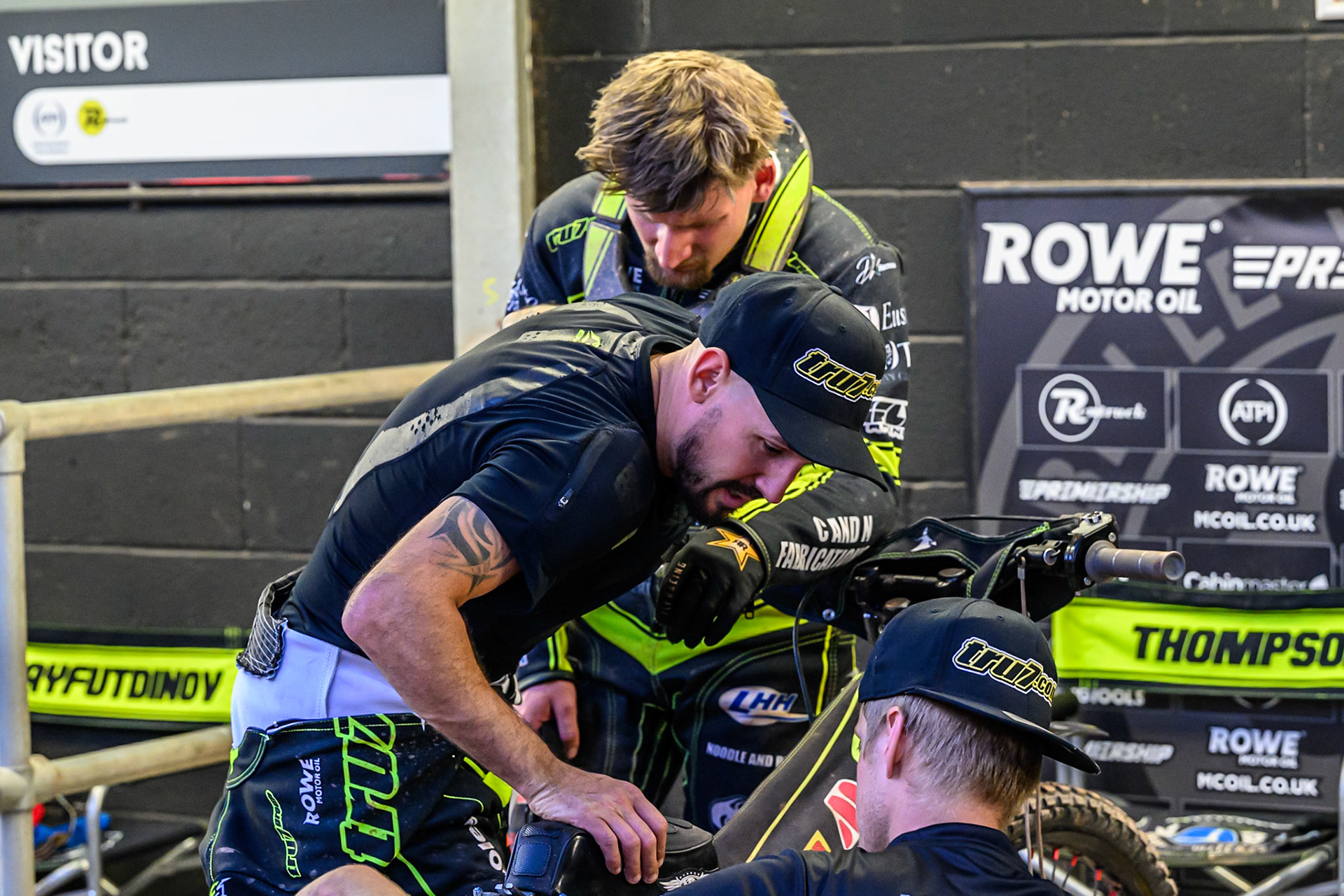 Ipswich Witches' Danny King in front of Ipswich Witches' Dan Thompson  as he checks Thompson’s bike after heat 14 during the Rowe Motor Oil Premiership match between Belle Vue Aces and Ipswich Witches at the National Speedway Stadium, Manchester on Monday 30th June 2025. (Photo: Ian Charles | MI News)