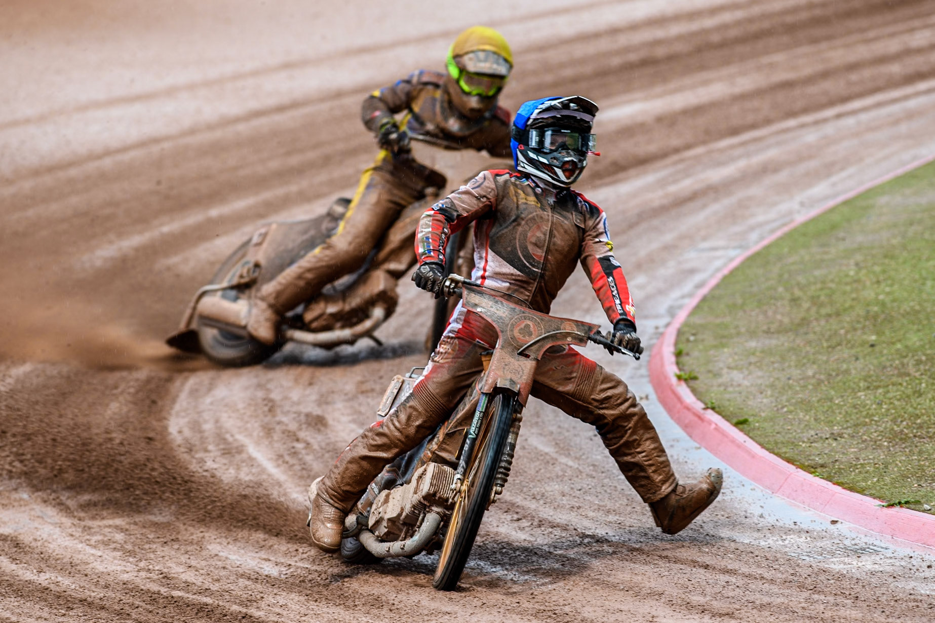 Belle Vue Aces' Connor Mountain in Blue loses traction ahead of Sheffield Tigers' Dan Gilkes in Yellow during the Rowe Motor Oil Premiership match between Belle Vue Aces and Sheffield Tigers at the National Speedway Stadium, Manchester on Monday 27th May 2024. (Photo: Ian Charles | MI News)
