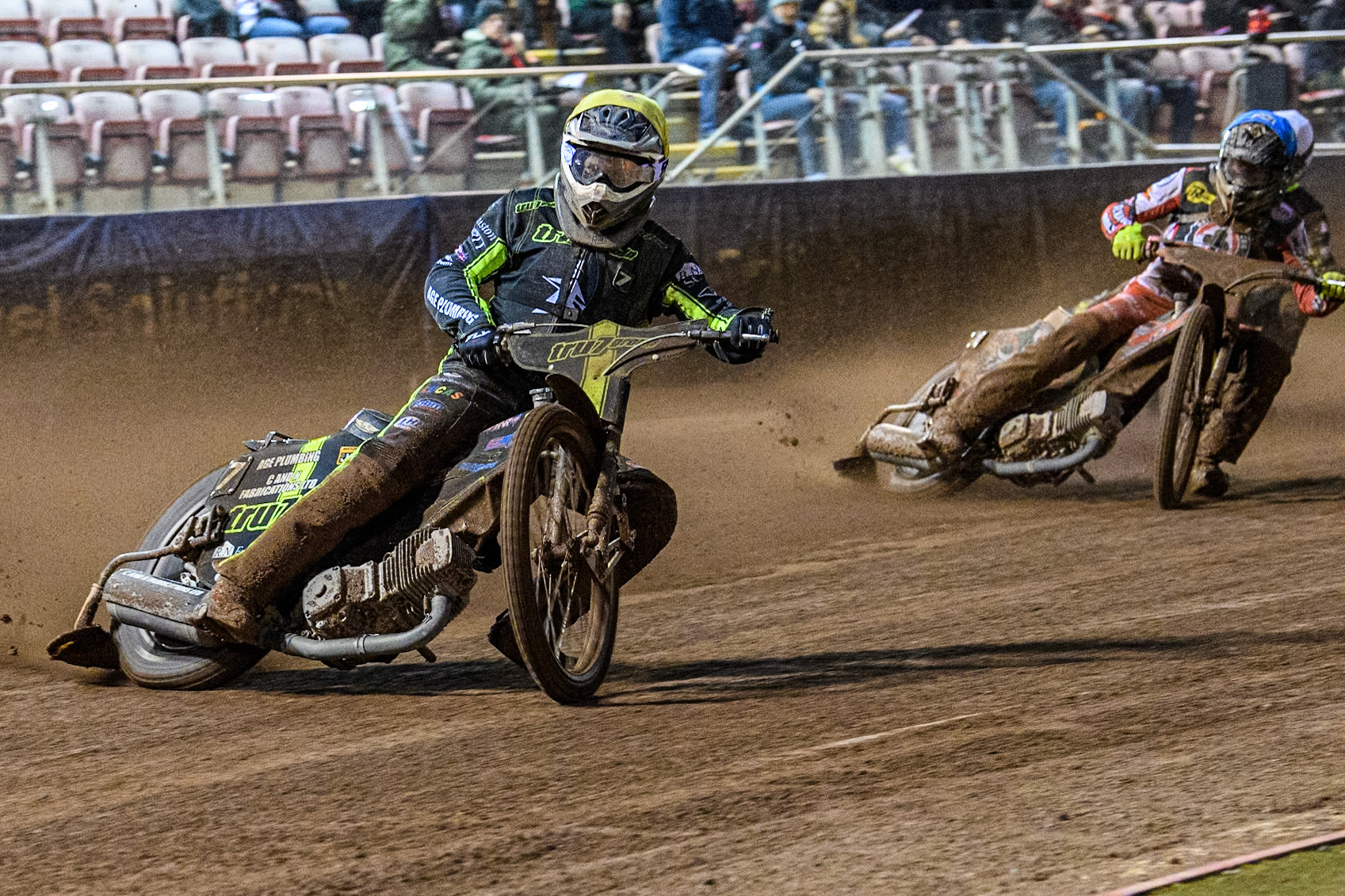 Ipswich Witches' Dan Thompson in Yellow leading Belle Vue Aces' Connor Bailey in Blue during the Rowe Motor Oil Premiership match between Belle Vue Aces and Ipswich Witches at the National Speedway Stadium, Manchester on Monday 22nd April 2024. (Photo: Ian Charles | MI News)