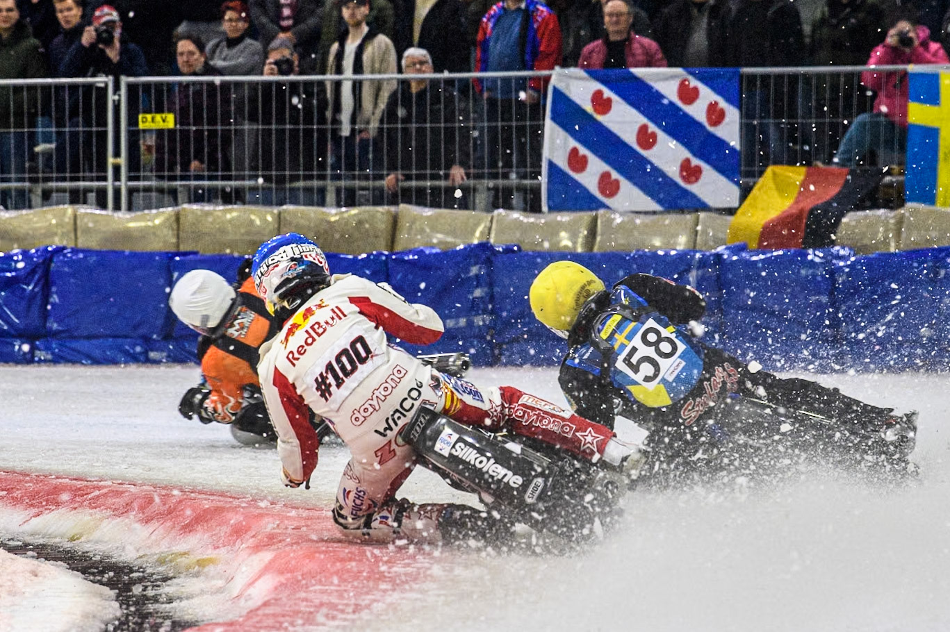 Austria's Franz Zorn (100) in Blue chases Sweden's Stefan Svensson (58) in Yellow and Finland's Aki Ala-Riihimäki (66) in White during the FIM Ice Speedway Gladiators World Championship Final 3 at Ice Rink Thialf, Heerenveen on Saturday 6th April 2024. (Photo: Ian Charles | MI News)