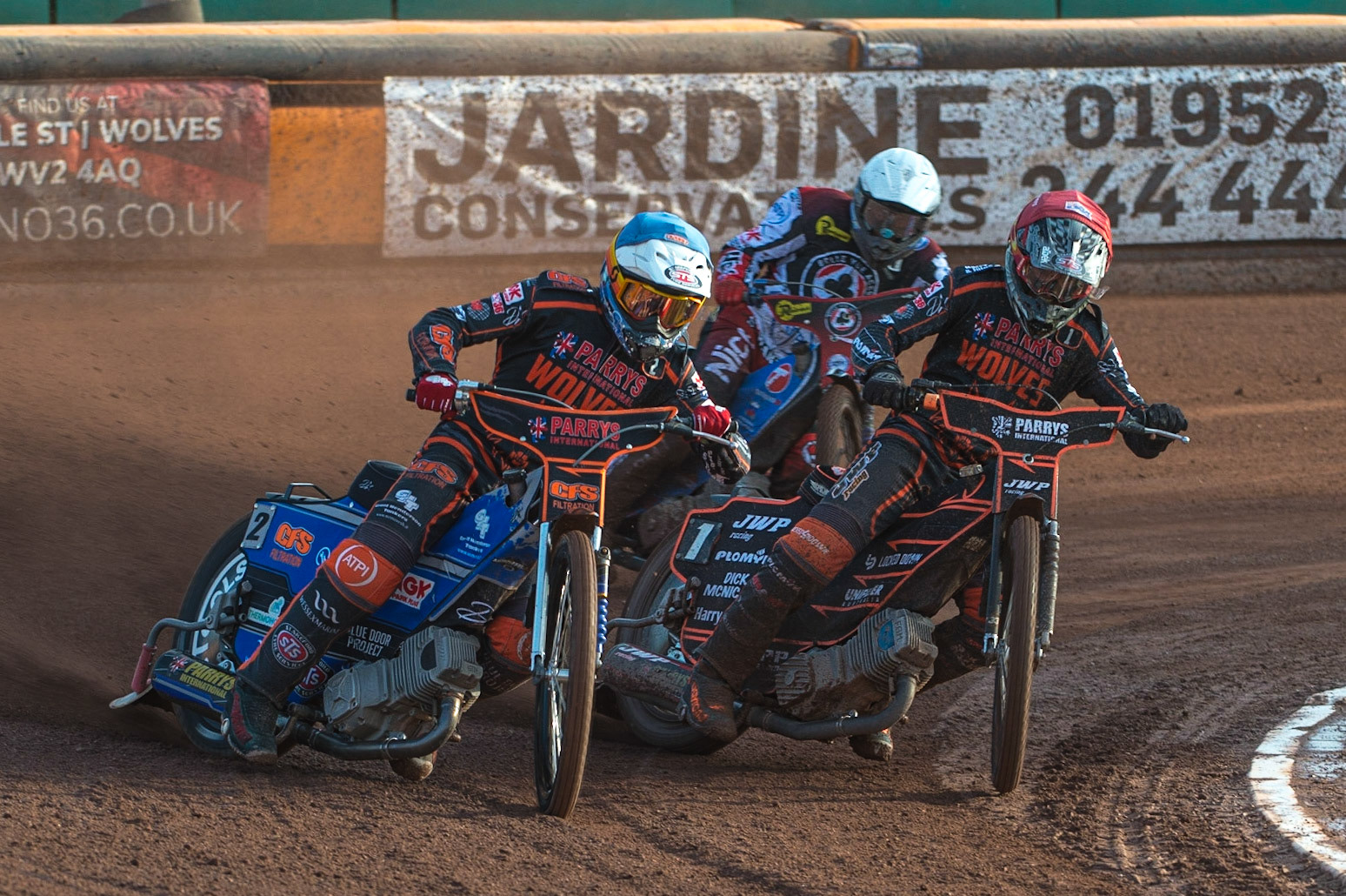 WOLVERHAMPTON, UK. JUN 20TH Steve Worrall  (Blue) and Sam Masters  (Red) lead Matej Zagar   (White) during the SGB Premiership match between Wolverhampton Wolves and Belle Vue Aces at Monmore Green Stadium, Wolverhampton on Monday 20th June 2022. (Credit: Ian Charles | MI News)