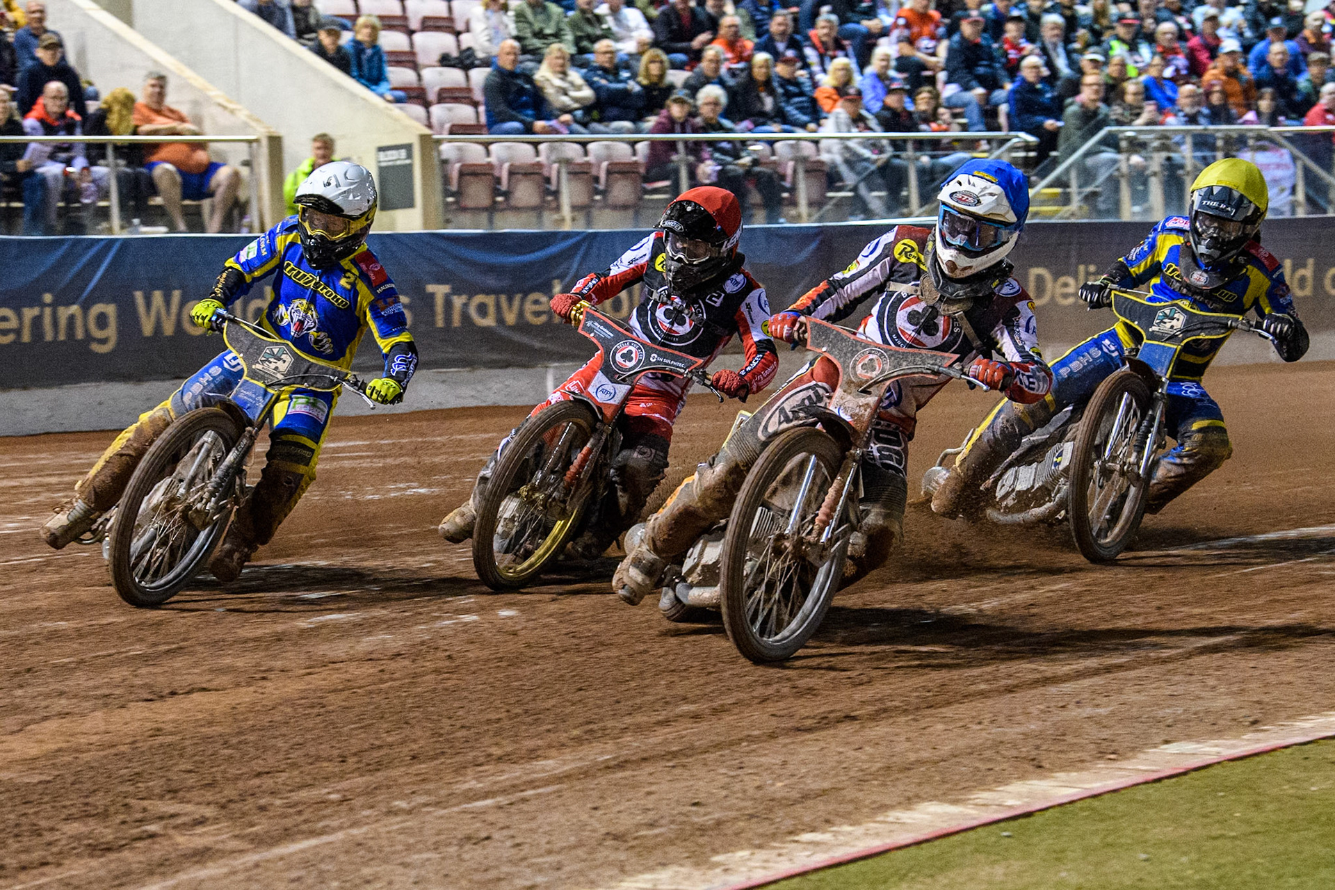 Belle Vue Aces' Jake Mulford in Blue leading Belle Vue Aces' Norick Blodorn  in Red, Sheffield Tigers' Kyle Howarth  in White and Sheffield Tigers' Dan Gilkes  in Yellow during the Rowe Motor Oil Premiership Play Off Semi Final 2, 1st Leg match between Belle Vue Aces and Sheffield Tigers at the National Speedway Stadium, Manchester on Monday 16th September 2024. (Photo: Ian Charles | MI News)