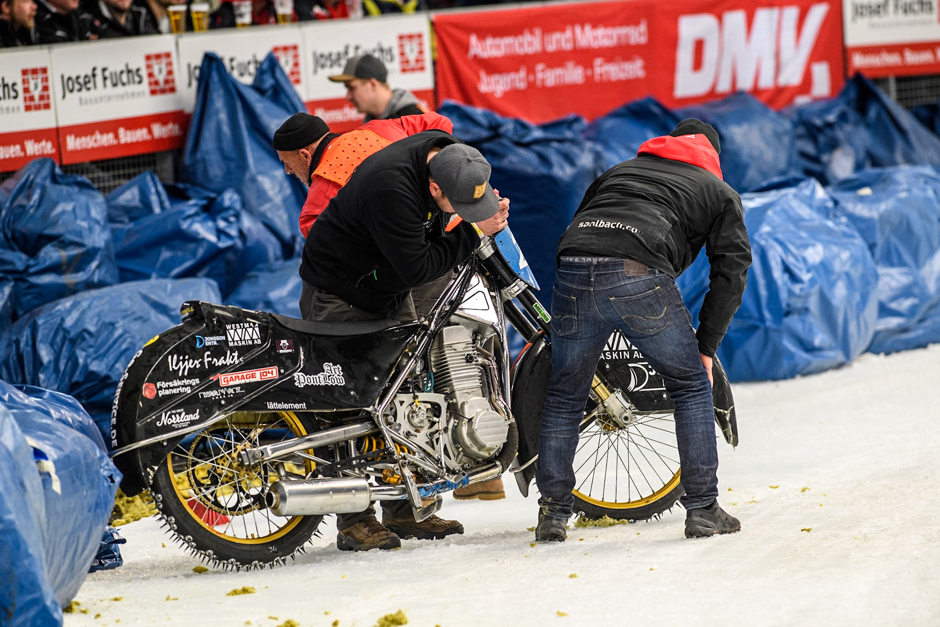 Mechanics check Horell’s bike after his crash during the FIM Ice Speedway Gladiators World Championship Final 2 at the Max-Aicher-Arena, Inzell on Sunday 24 March 2024. (Photo: Ian Charles | MI News)