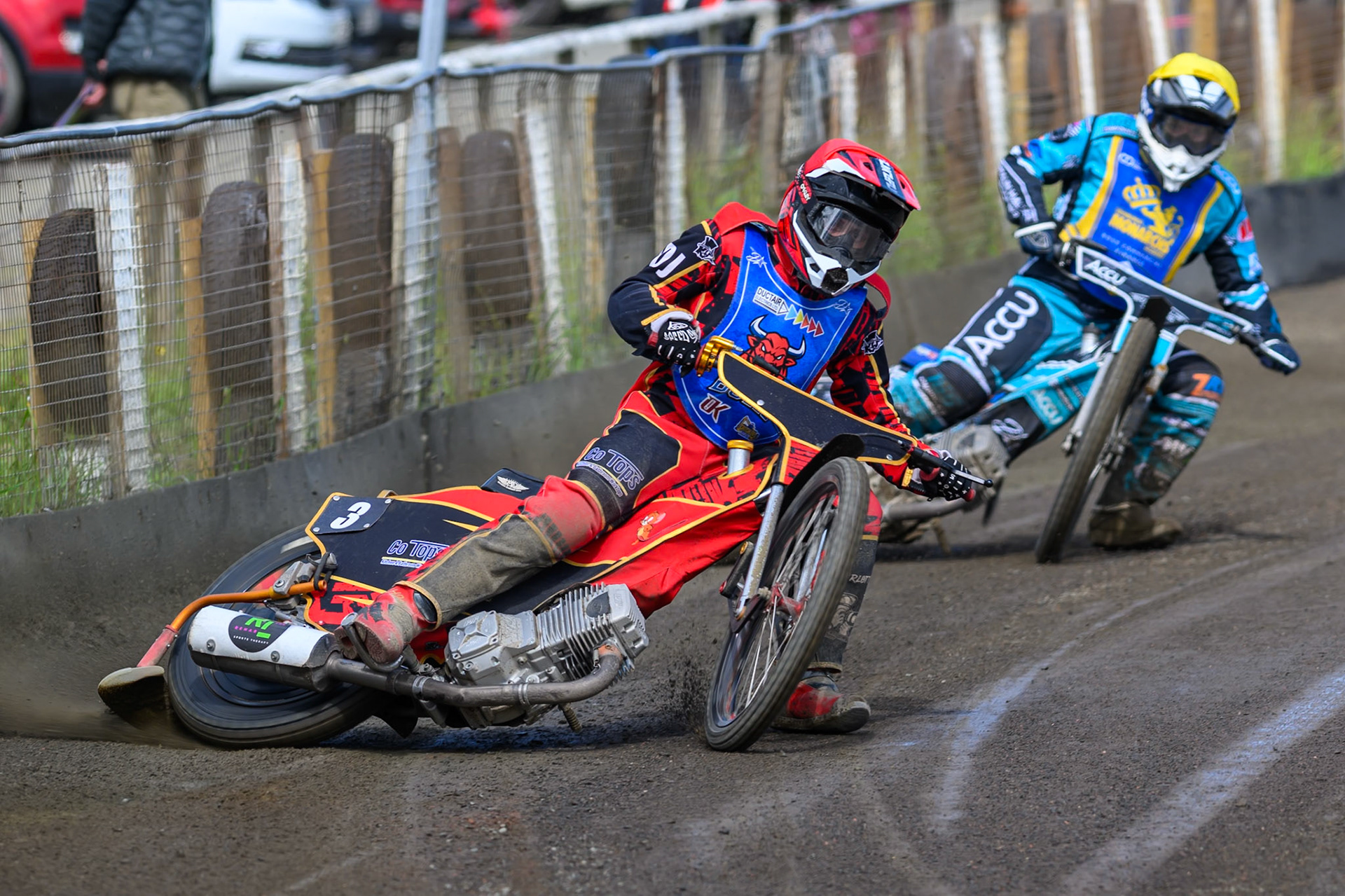 Luke Harris of Buxton Bulls  in Red leading Jamie Halder of Edinburgh Monarchs Academy in Yellow during the WSRA National Development League match between Buxton Bulls and Edinburgh Monarchs Academy at Hi-Edge Speedway, Buxton on Sunday 14th June 2026. (Photo: Ian Charles | MI News)