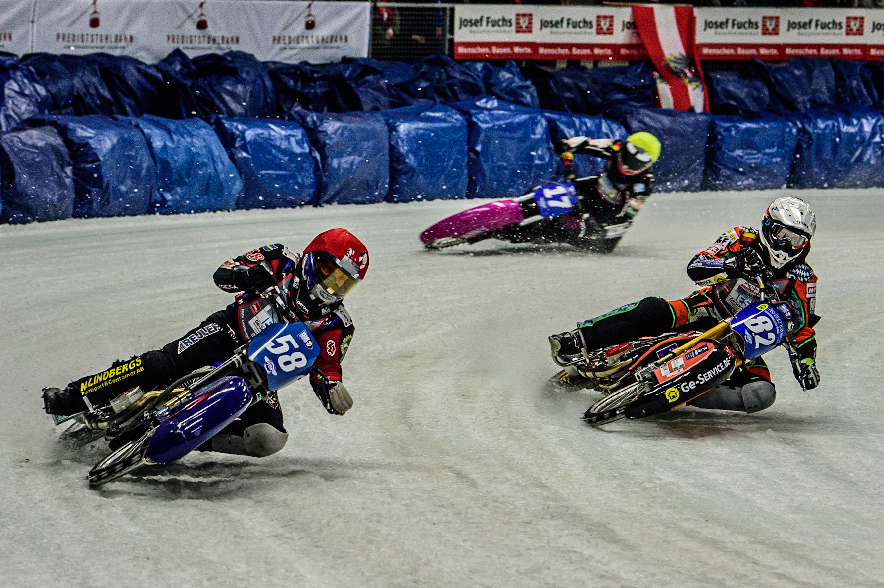 Stefan Svensson (58) (Red) outside Markus Jell (82) (White) and Benedikt Monn (17) (Reserve) (Yellow) during the Ice Speedway Gladiators World Championship Final 1 at Max-Aicher-Arena, Inzell, Germany on Saturday 18th March 2023. (Photo: Ian Charles | MI News)