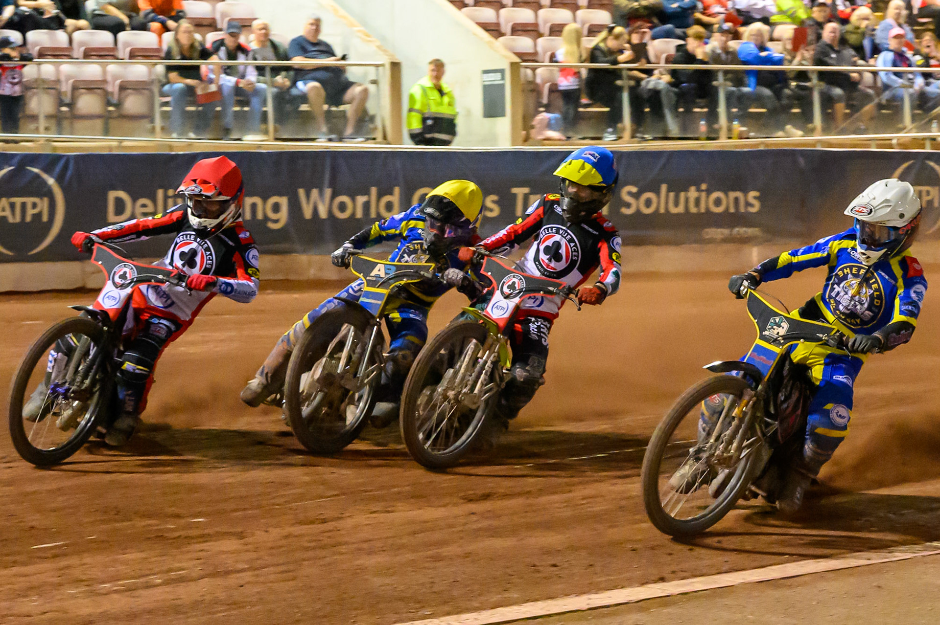 Leon Flint of Sheffield Tigers in White on the inside of Tate Zischke of Belle Vue Aces  in Blue, Luke Killeen of Sheffield Tigers in Yellow  and Zach Cook of Belle Vue Aces in Red during the Rowe Motor Oil Premiership match between Belle Vue Aces and Sheffield Tigers at the National Speedway Stadium, Manchester on Monday 14th September 2026. (Photo: Ian Charles | MI News)