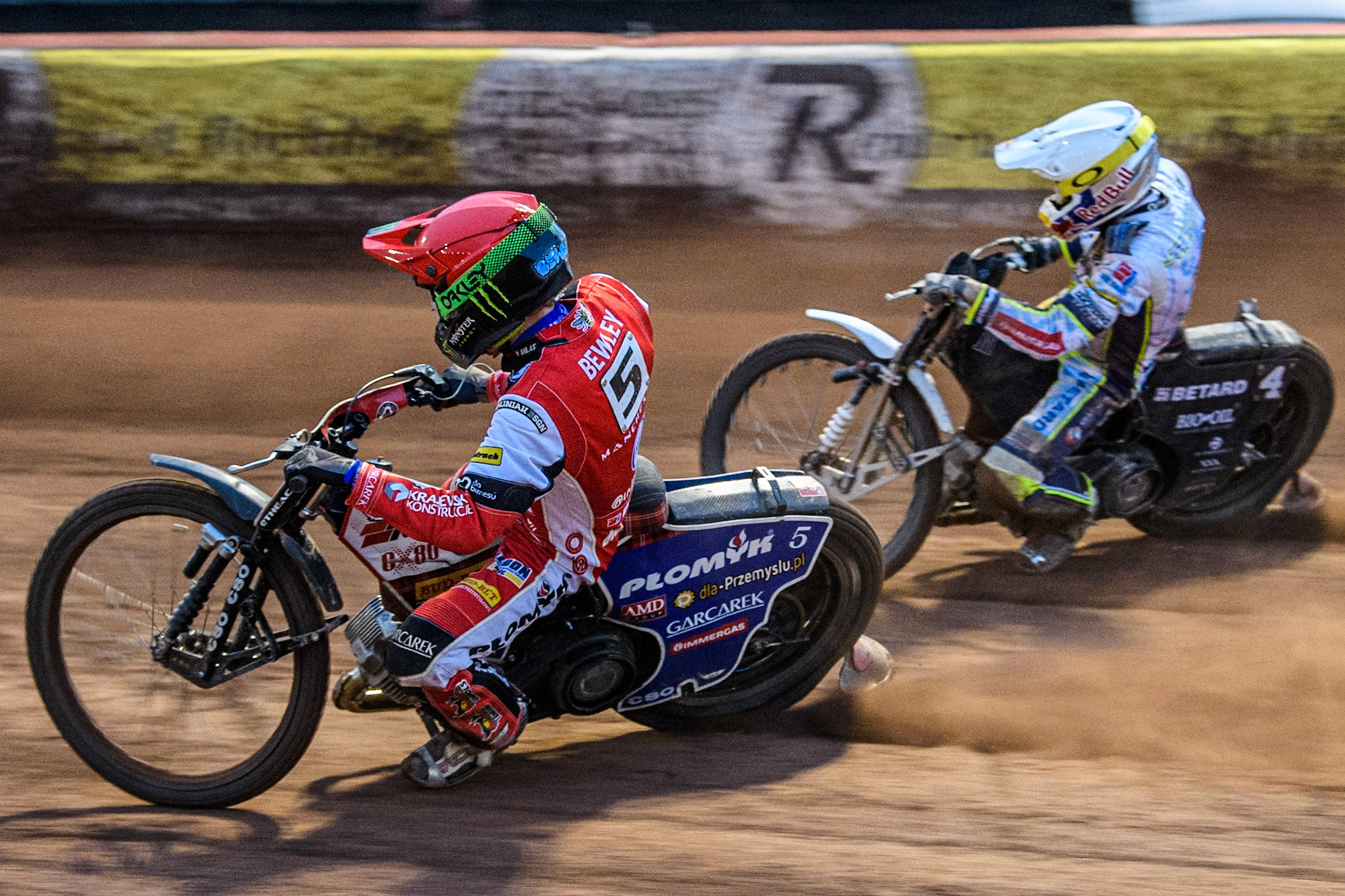 Belle Vue Aces' Dan Bewley in Red passes Oxford Spires' Maciej Janowski in White on the inside during the Rowe Motor Oil Premiership match between Belle Vue Aces and Oxford Spires at the National Speedway Stadium, Manchester on Monday 13th May 2024. (Photo: Ian Charles | MI News)