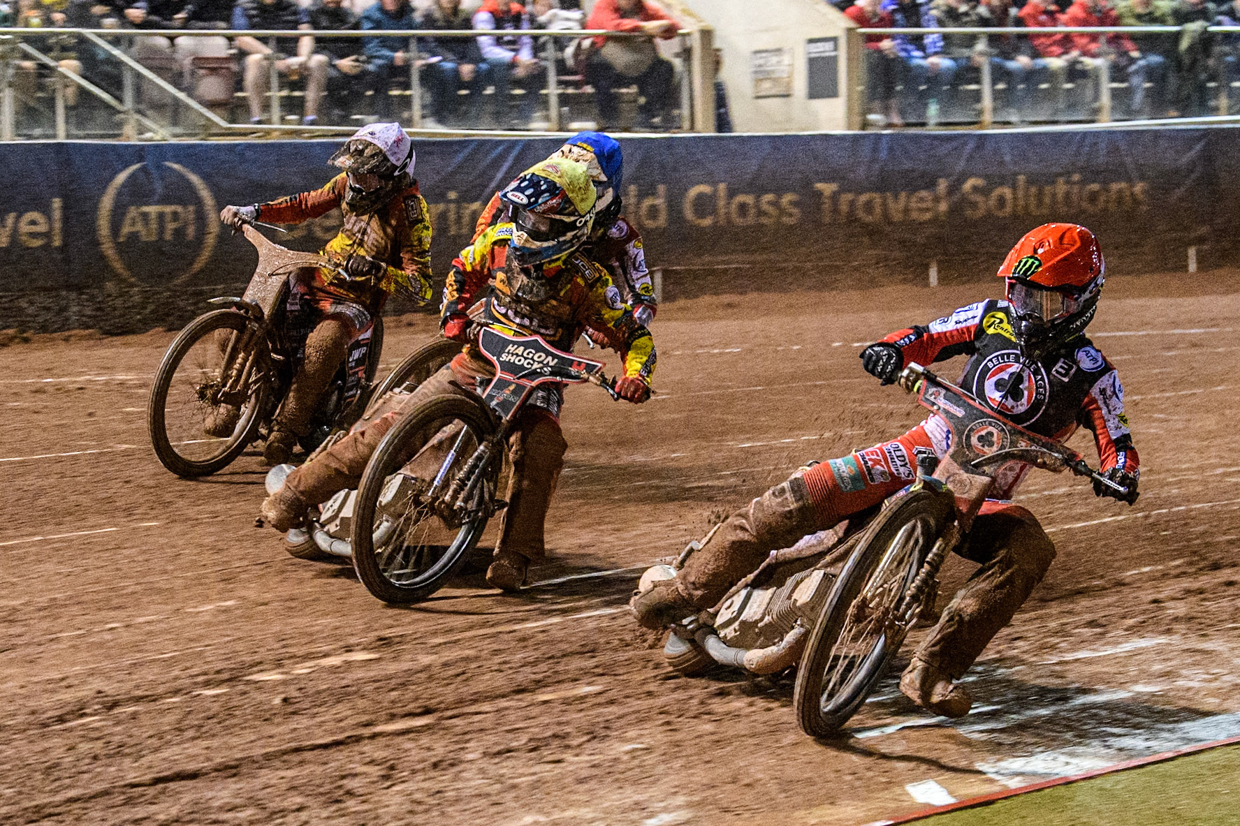 Belle Vue Aces' Jaimon Lidsey  in Red rides inside Leicester Lions' Sam Hagon  in Yellow Belle Vue Aces' Jake Mulford  in Blue and Leicester Lions' Sam Masters  in White during the Rowe Motor Oil Premiership Grand Final 1st Leg between Belle Vue Aces and Leicester Lions at the National Speedway Stadium, Manchester on Monday 23rd September 2024. (Photo: Ian Charles | MI News)