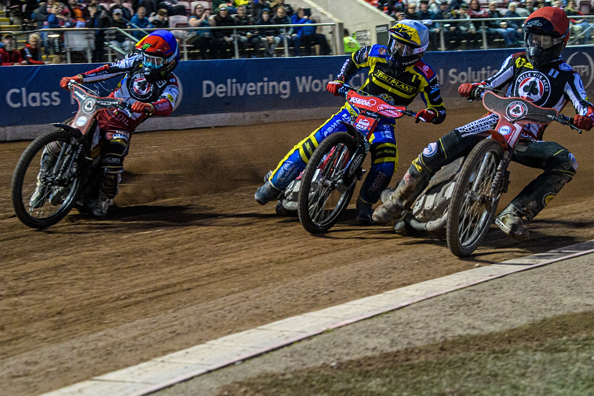 Brady Kurtz (Red) inside Tobiasz Musielak (White) and Dan Bewley (Blue) during the Sports Insure Premiership match between Belle Vue Aces and Sheffield Tigers at the National Speedway Stadium, Manchester on Monday 7th August 2023. (Photo: Ian Charles | MI News)